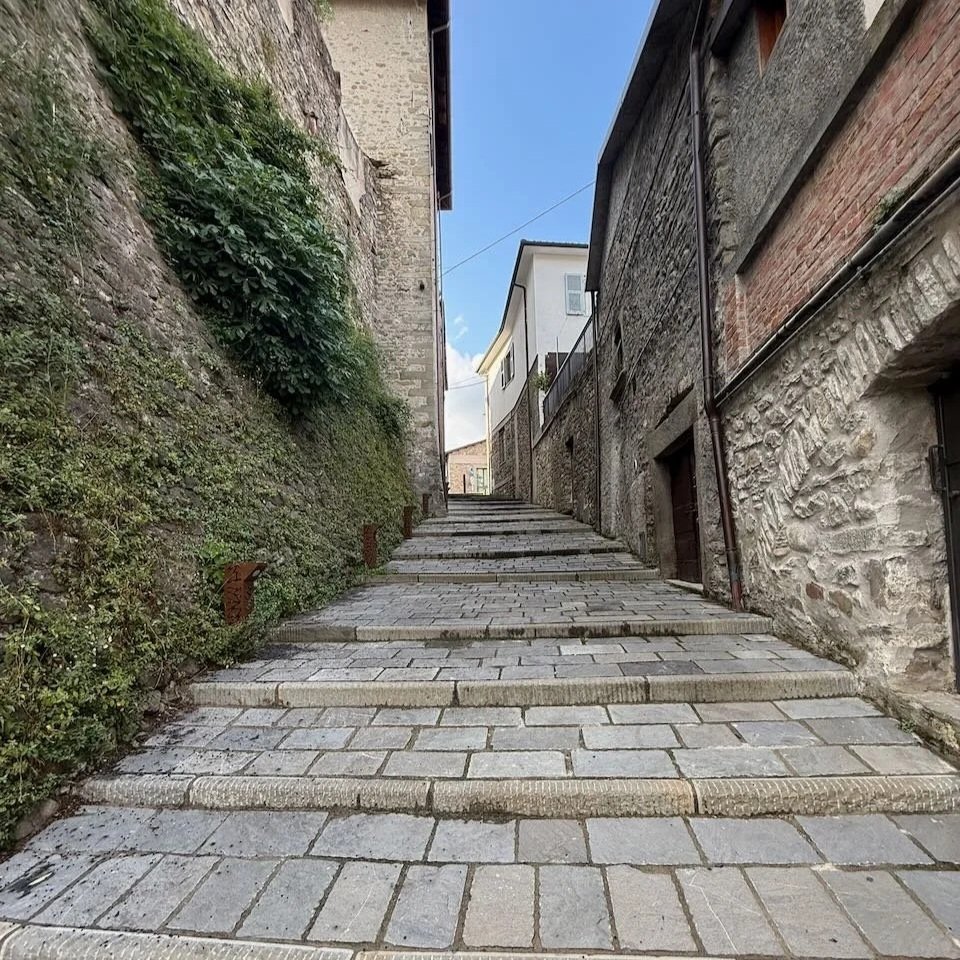 Stone Alley in Tuscany with steps uphill