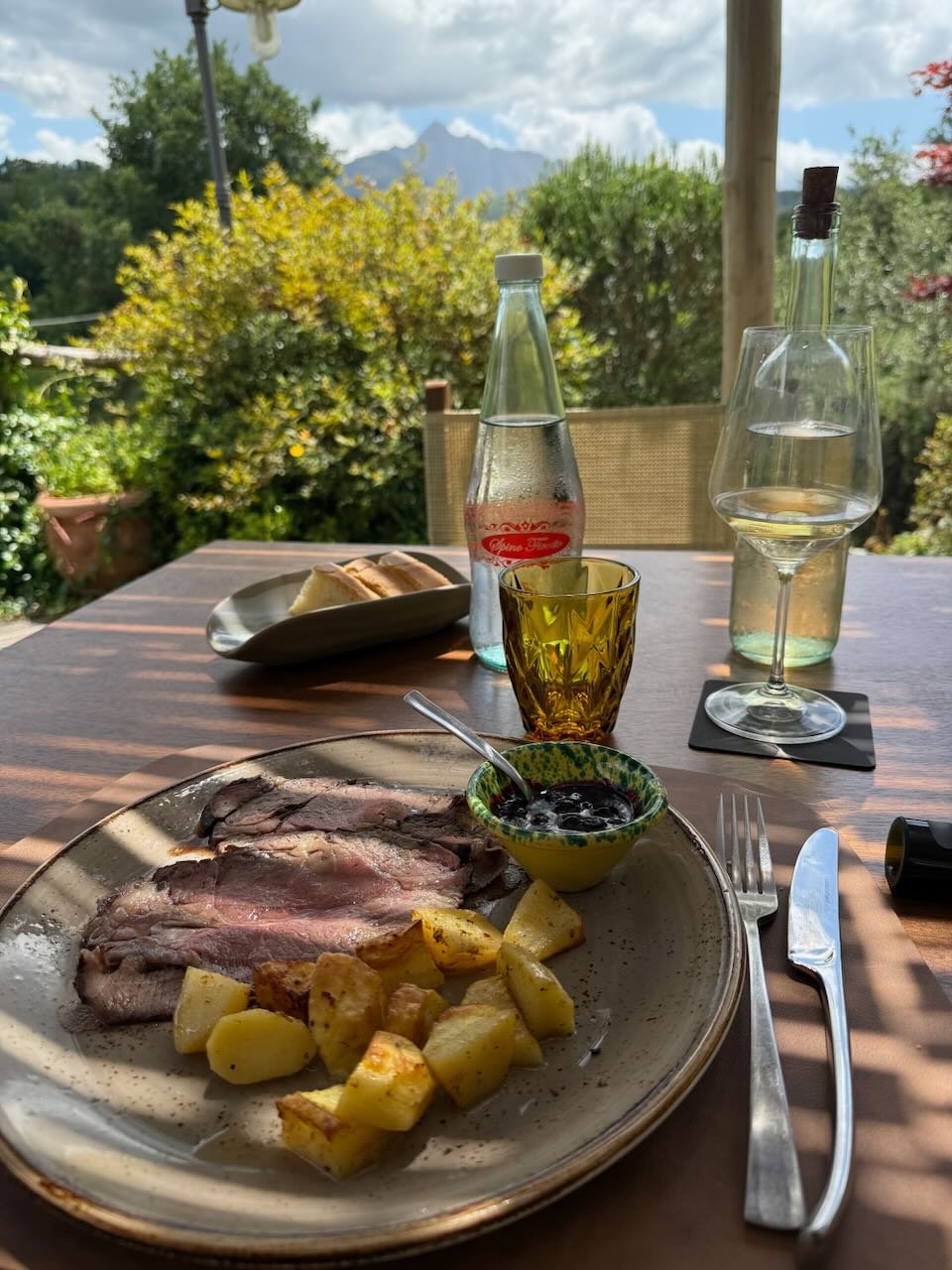 Lunch outside with wine on a table in Tuscany