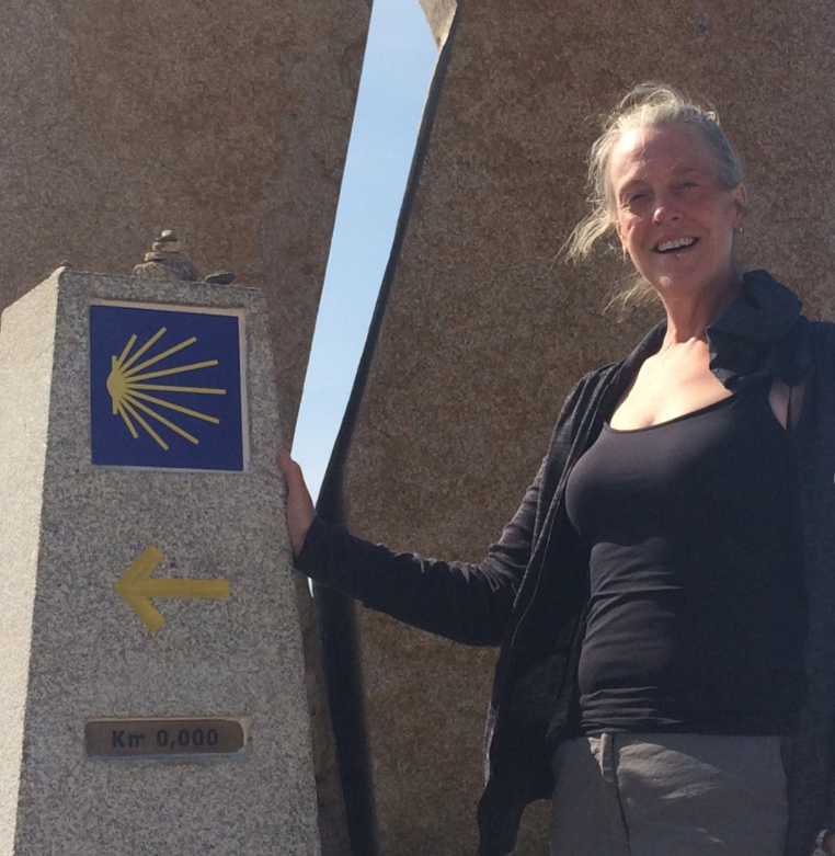 Leslie stands at the last point on her 2018 Camino.