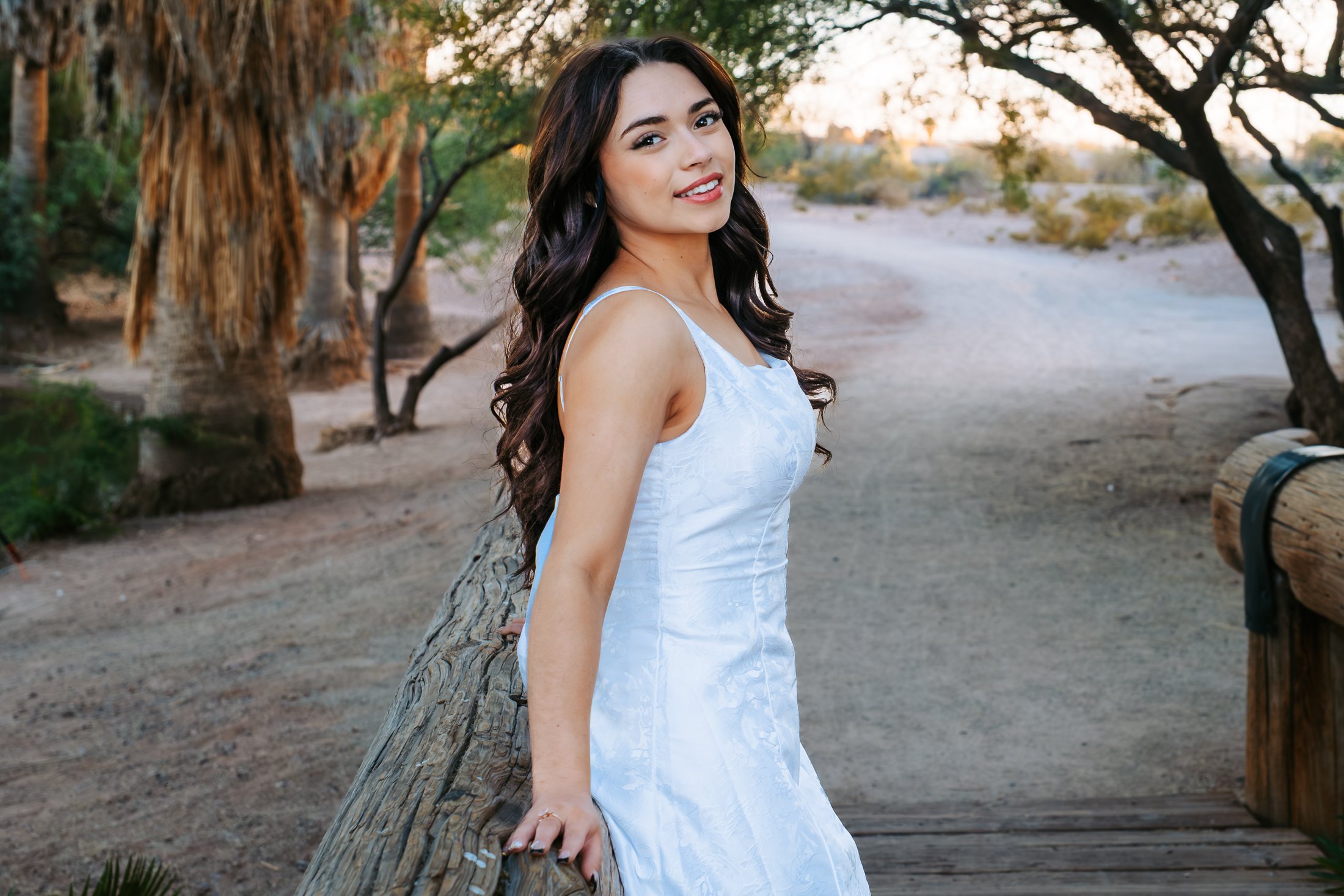 Senior girl sitting on a bridge at Evelyn Hallman Park in Tempe senior portrait session
