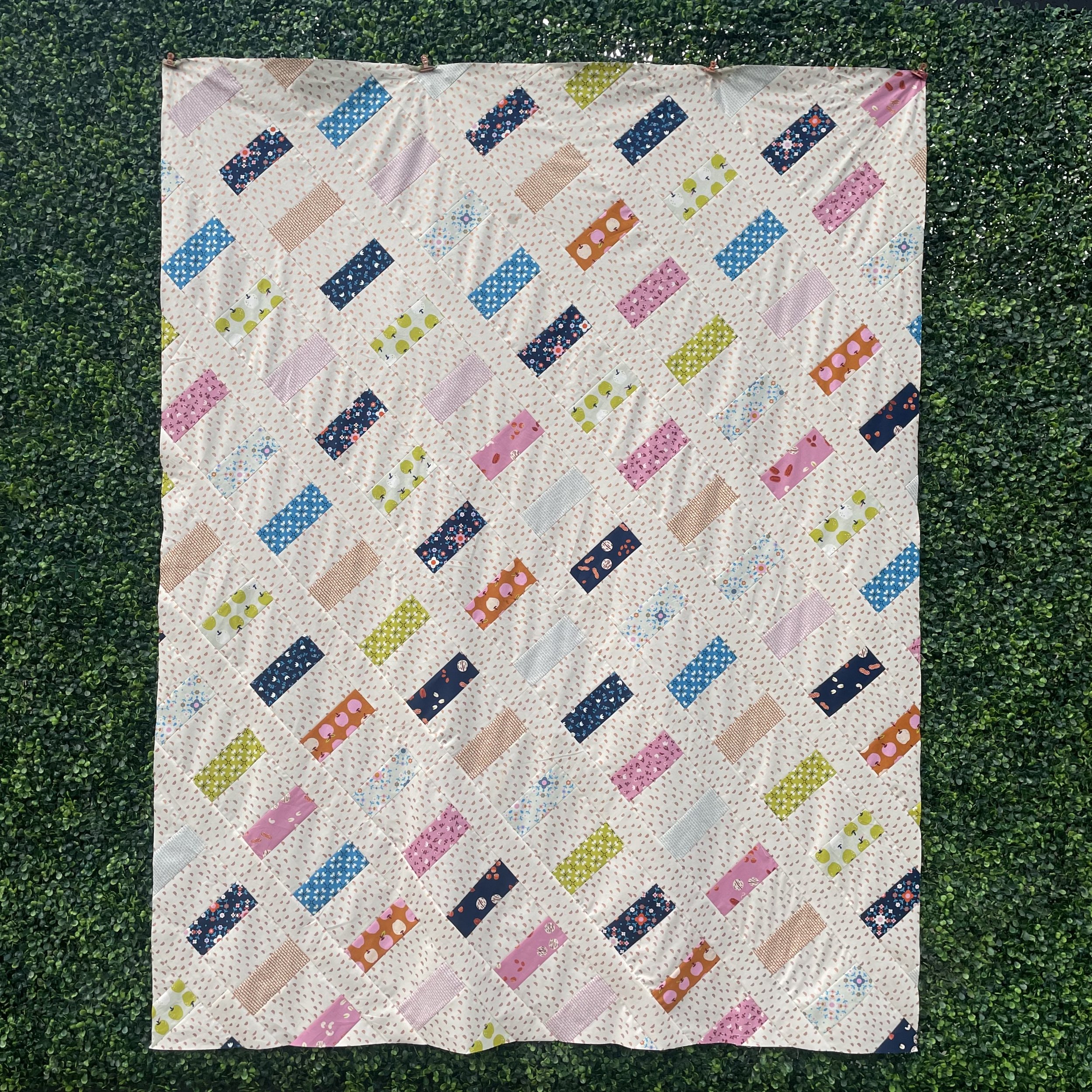 Home Office a yardage, fat quarter, jelly roll, and scrap friendly quilt pattern. Ruby Star Society Smol fabric. Scrappy Ruby Star Society quilt.