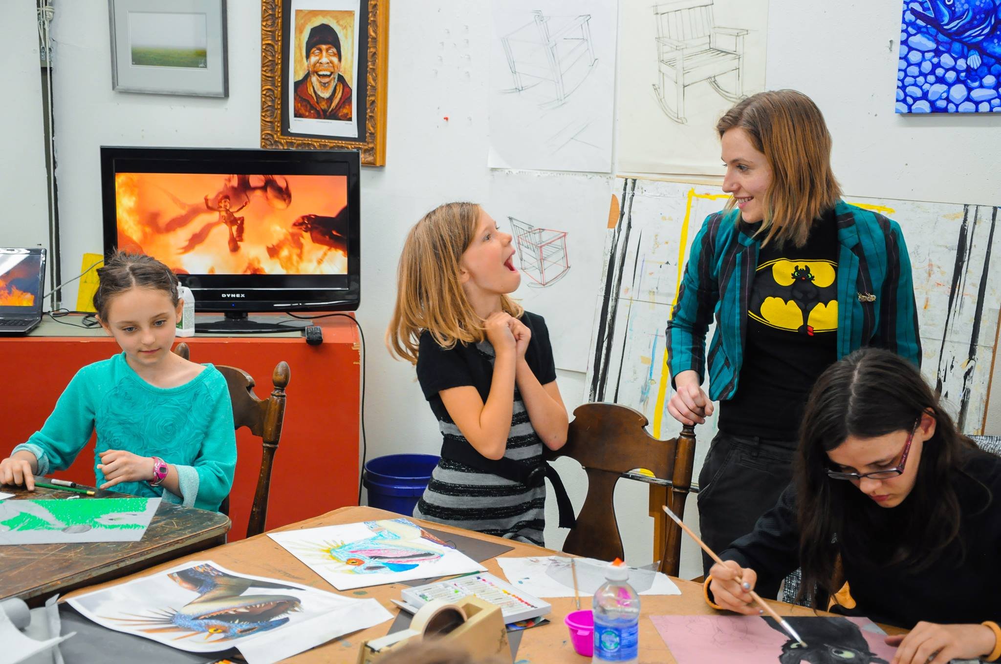 Young Art Student and Teacher Excitedly Discussing their Project
