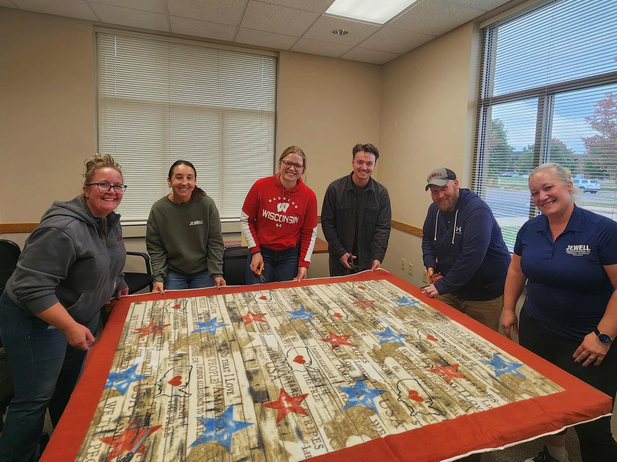 The real estate negotiation group partnered with Team Severson & Friends for their annual Tie Blanket-Making Day! Together, they created cozy blankets that will be donated to homebound seniors who receive ADRC meals.
These seniors, who may not h