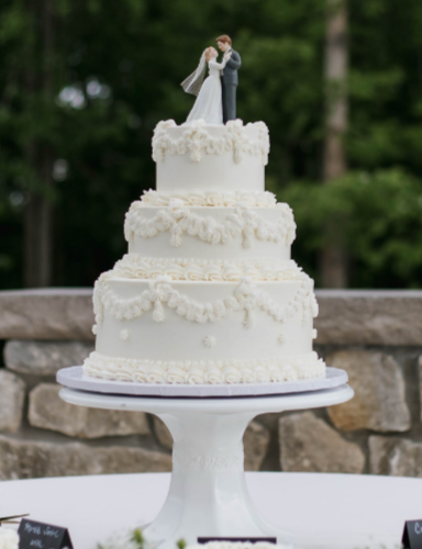An elegant vintage white wedding cake at Hocking Hills Lodge