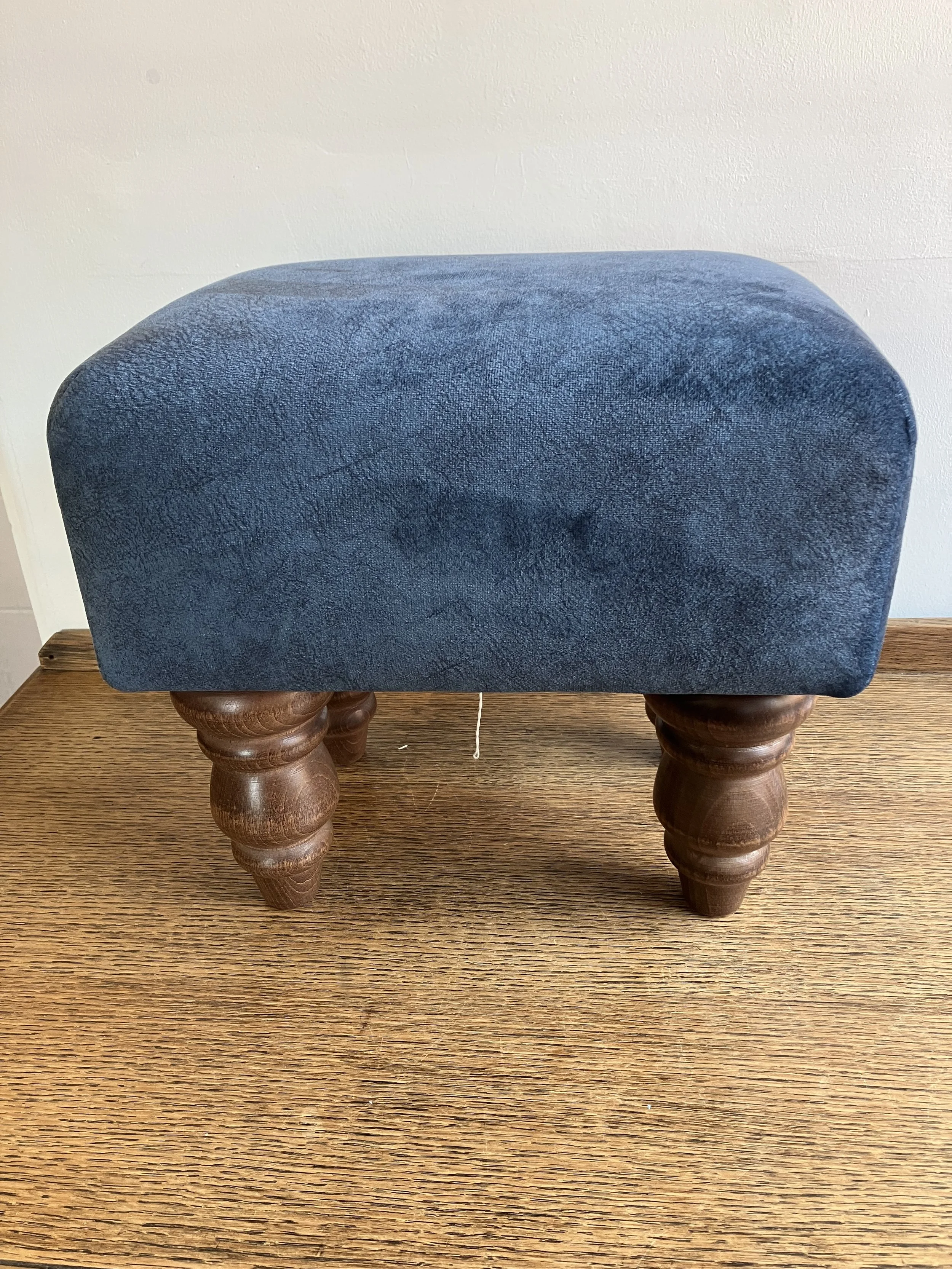 Small Teal Coloured Upholstered Footstool on Wooden Legs