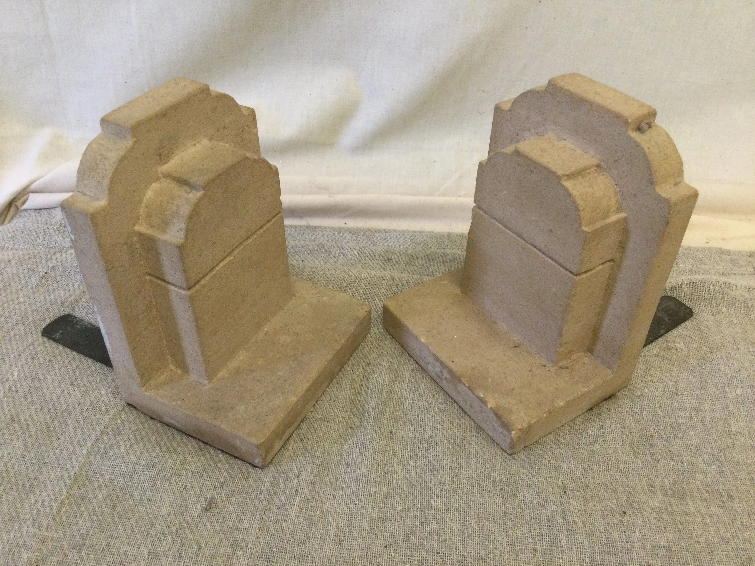 Pair of Concrete Corbel Shaped Bookends with Metal Stands