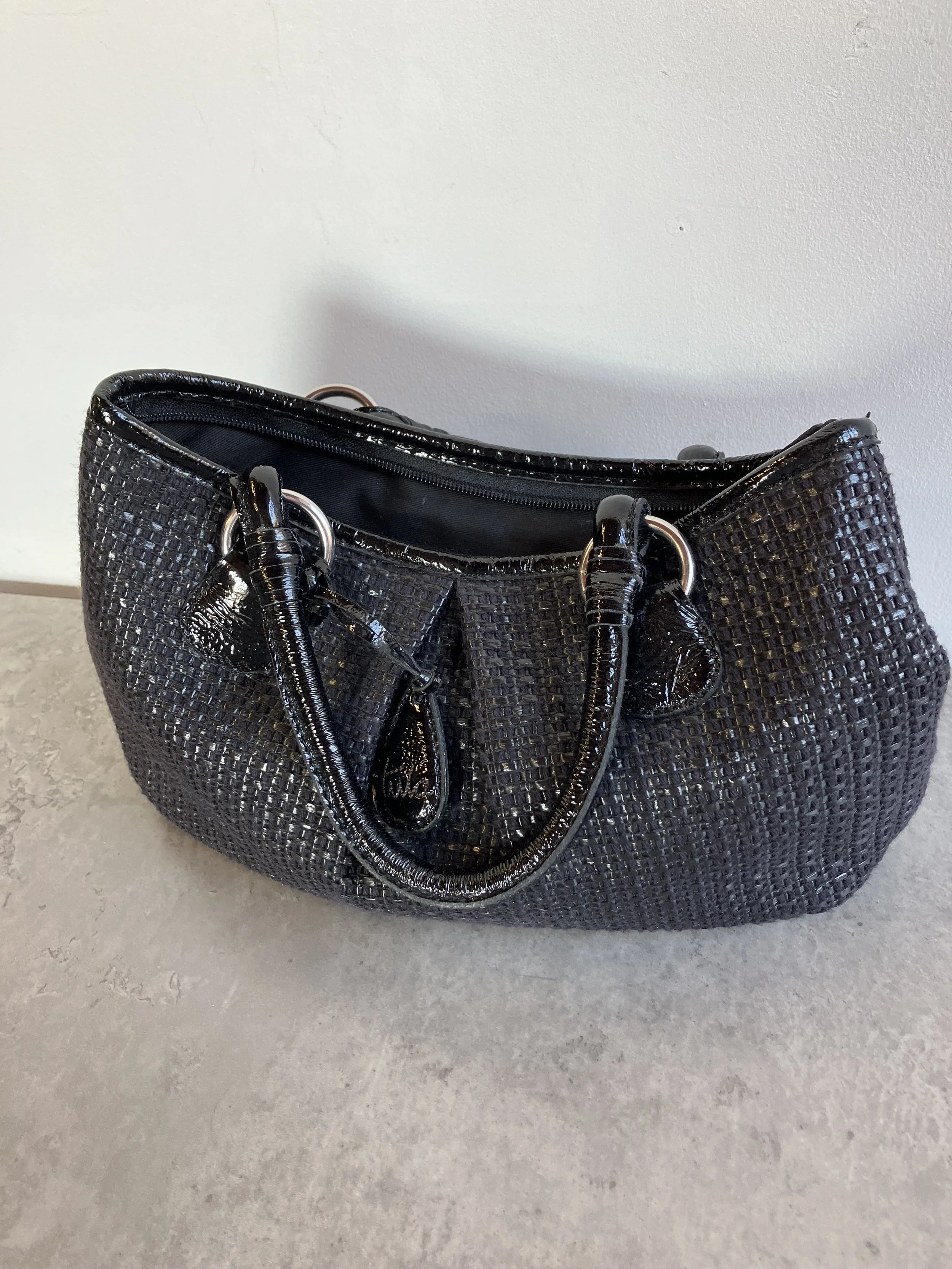 Black Woven Effect Leather Hand Bag by Tula