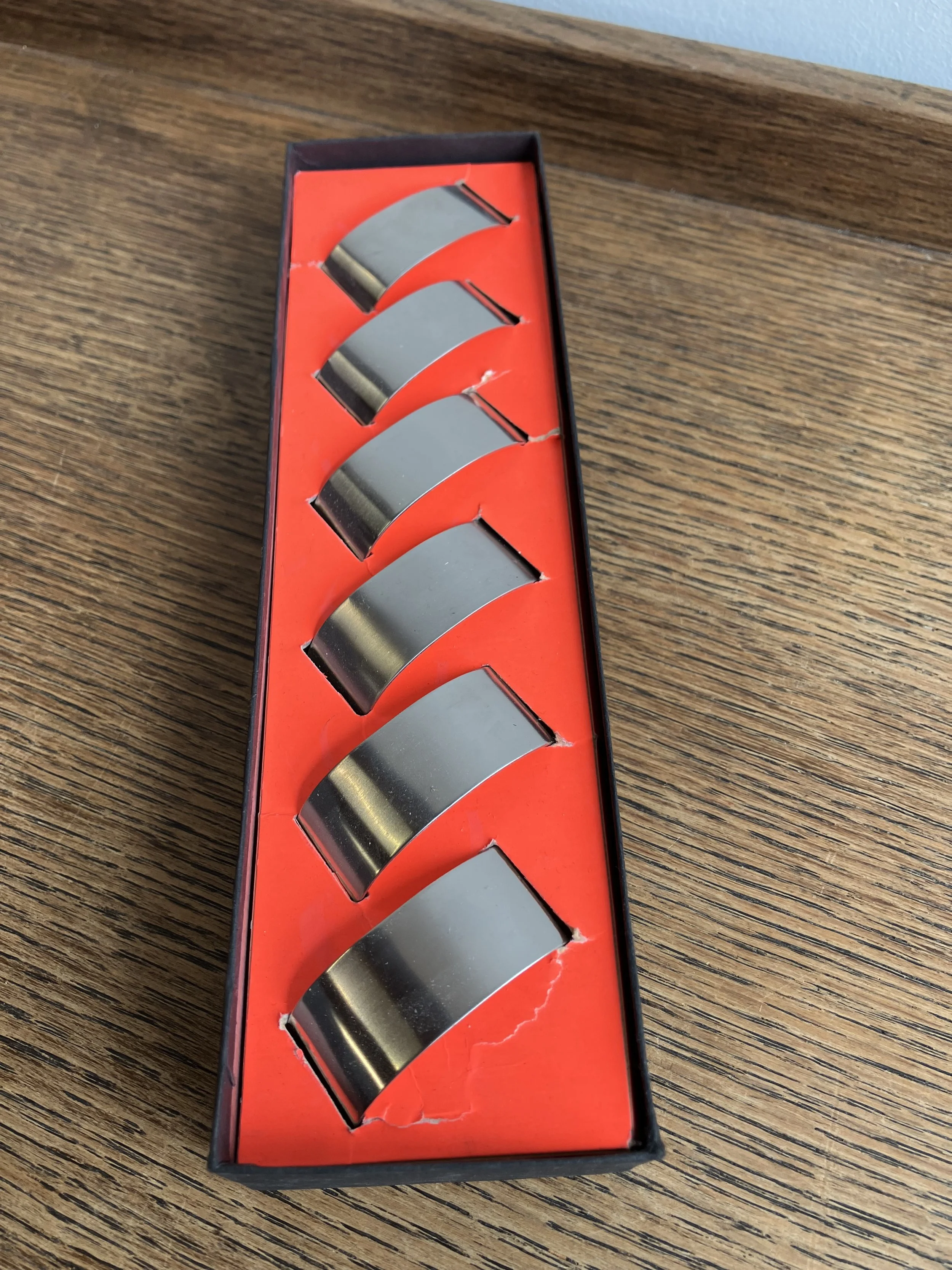 Set of Six Stainless Steel Napkin Rings in Box