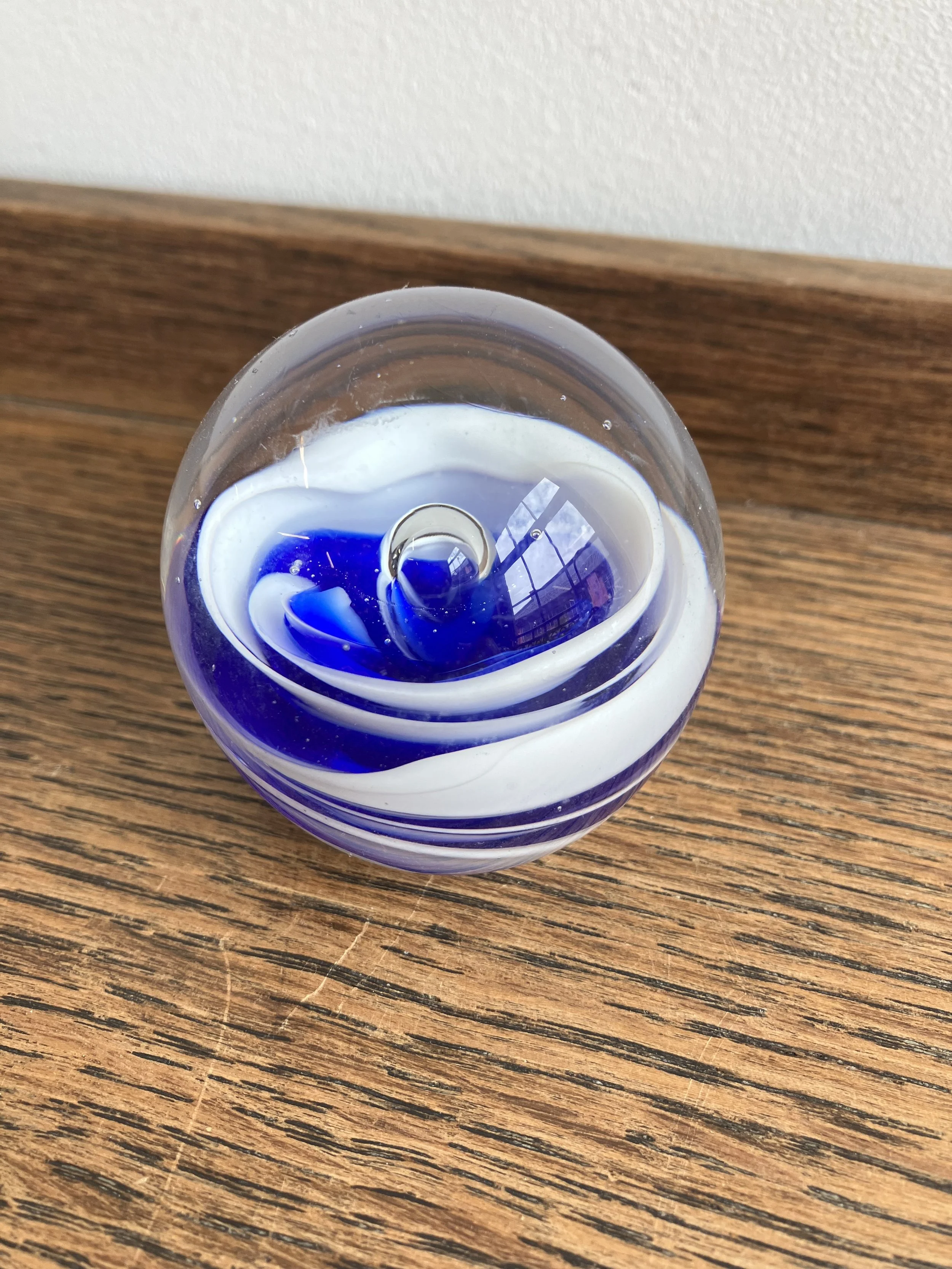 Small Blue Glass Paperweight with White Swirl Pattern