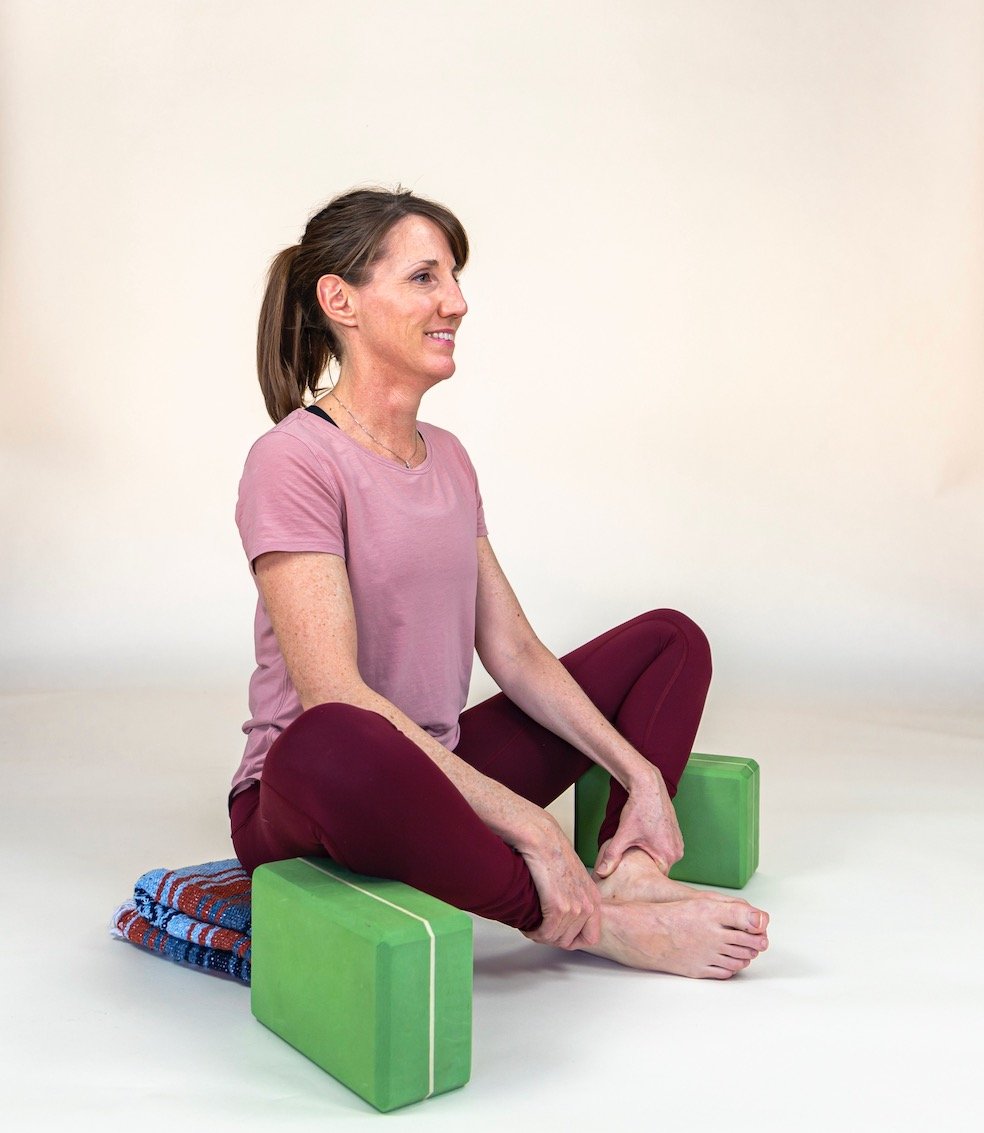 With the right yoga cues and props all students can find comfort in Cobbler pose.