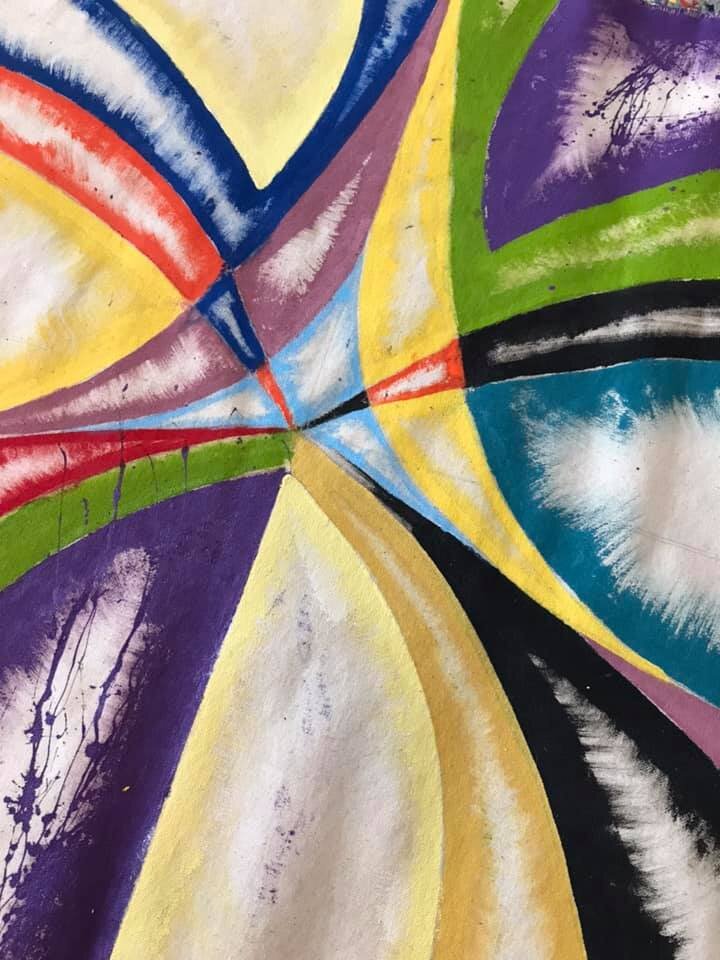 A close-up of the "dry" side of the canvas (before the splatter-and-drip painting technique is applied).