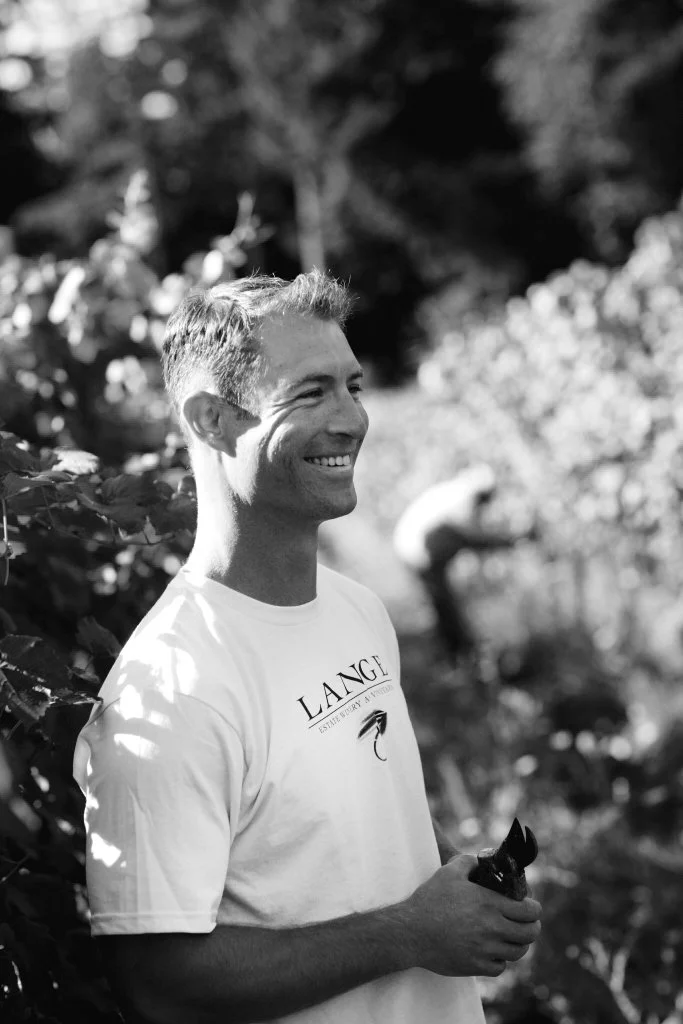Man in vineyard holding pruners