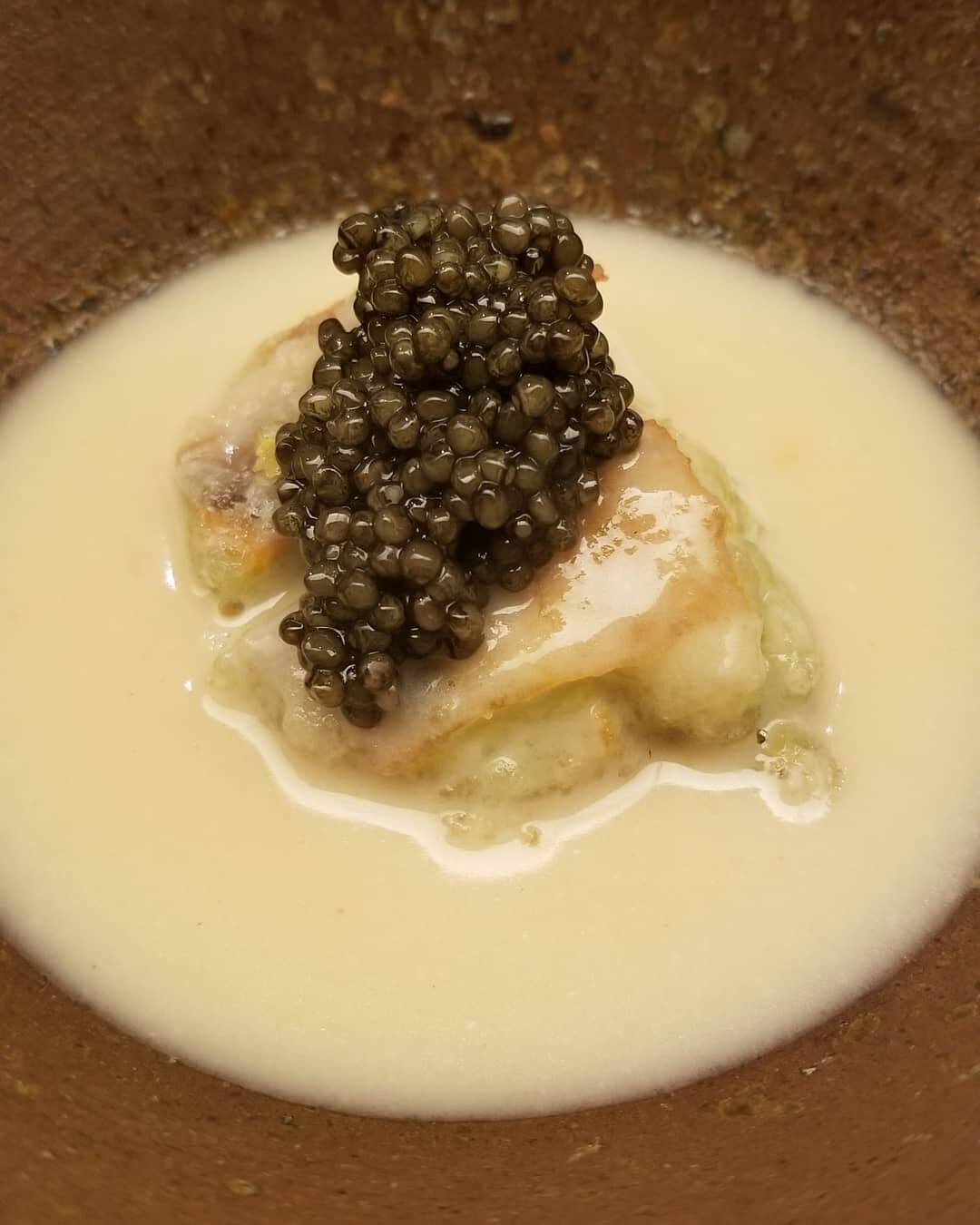 Deep fried blue crab served with chowder and topped with caviar