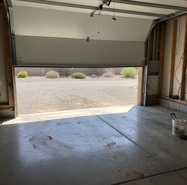 Garage Door Hard to Lift? How to Tell Spring From Balance