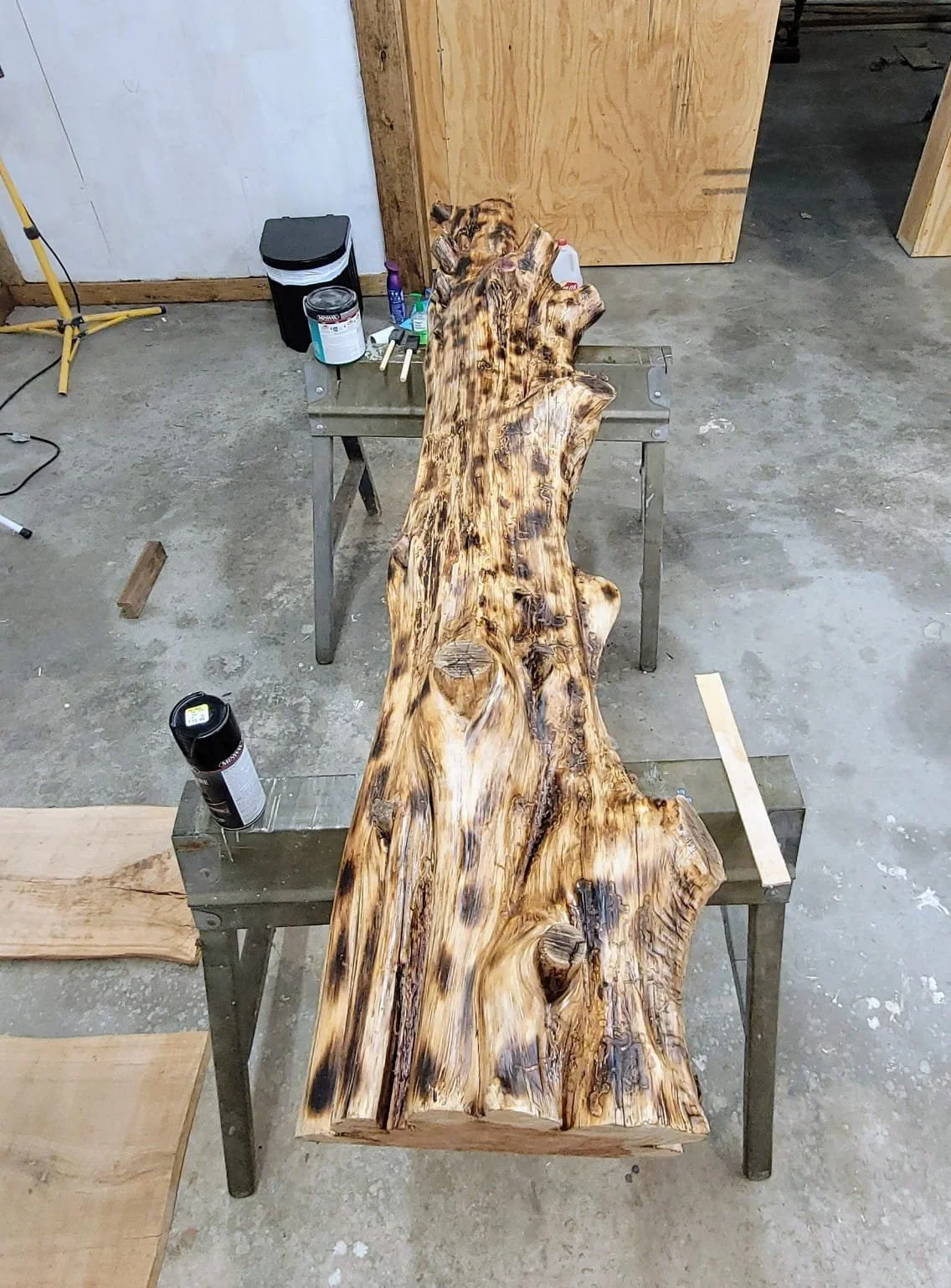 A piece of wood getting a finishing coat.