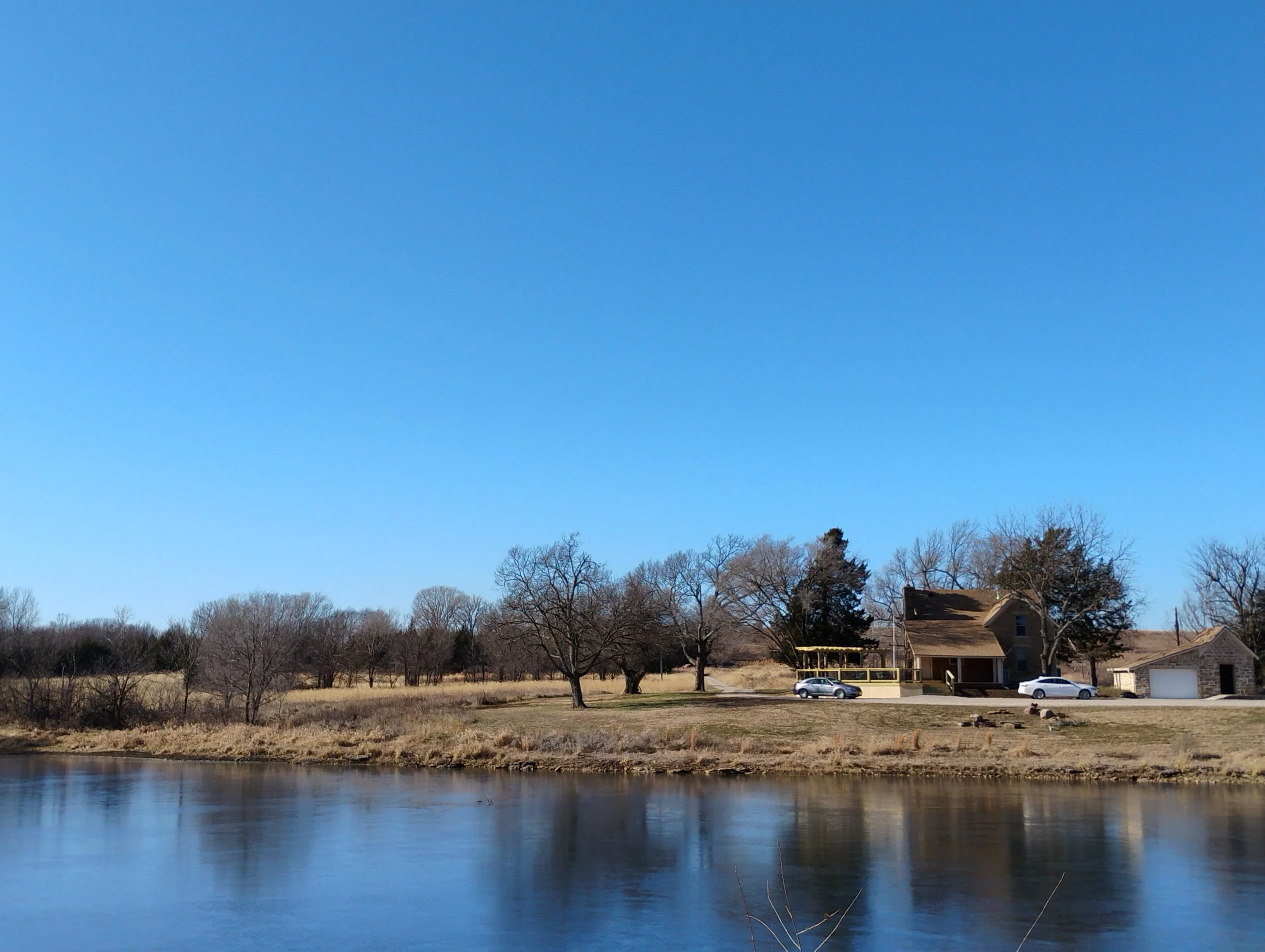 An overlook of the pond and house from the Eastern part of the trail.