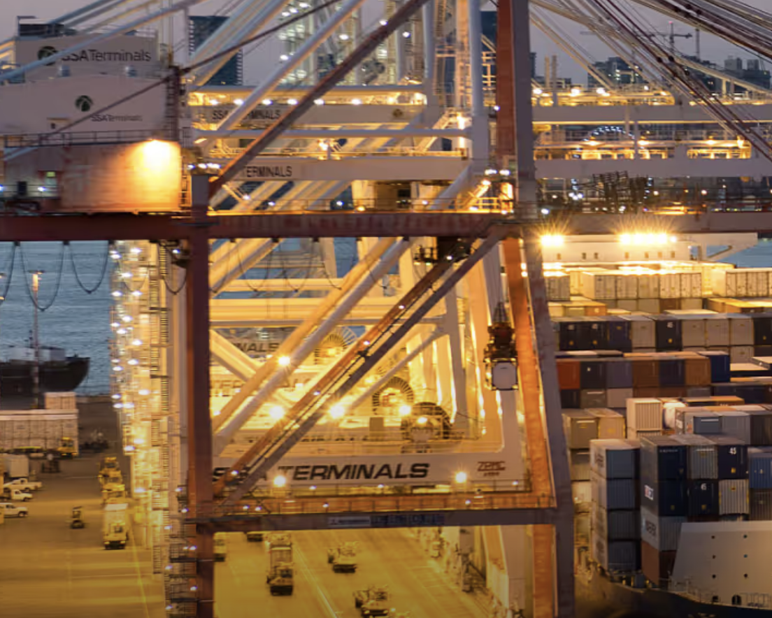A large container terminal with stacked shipping containers.