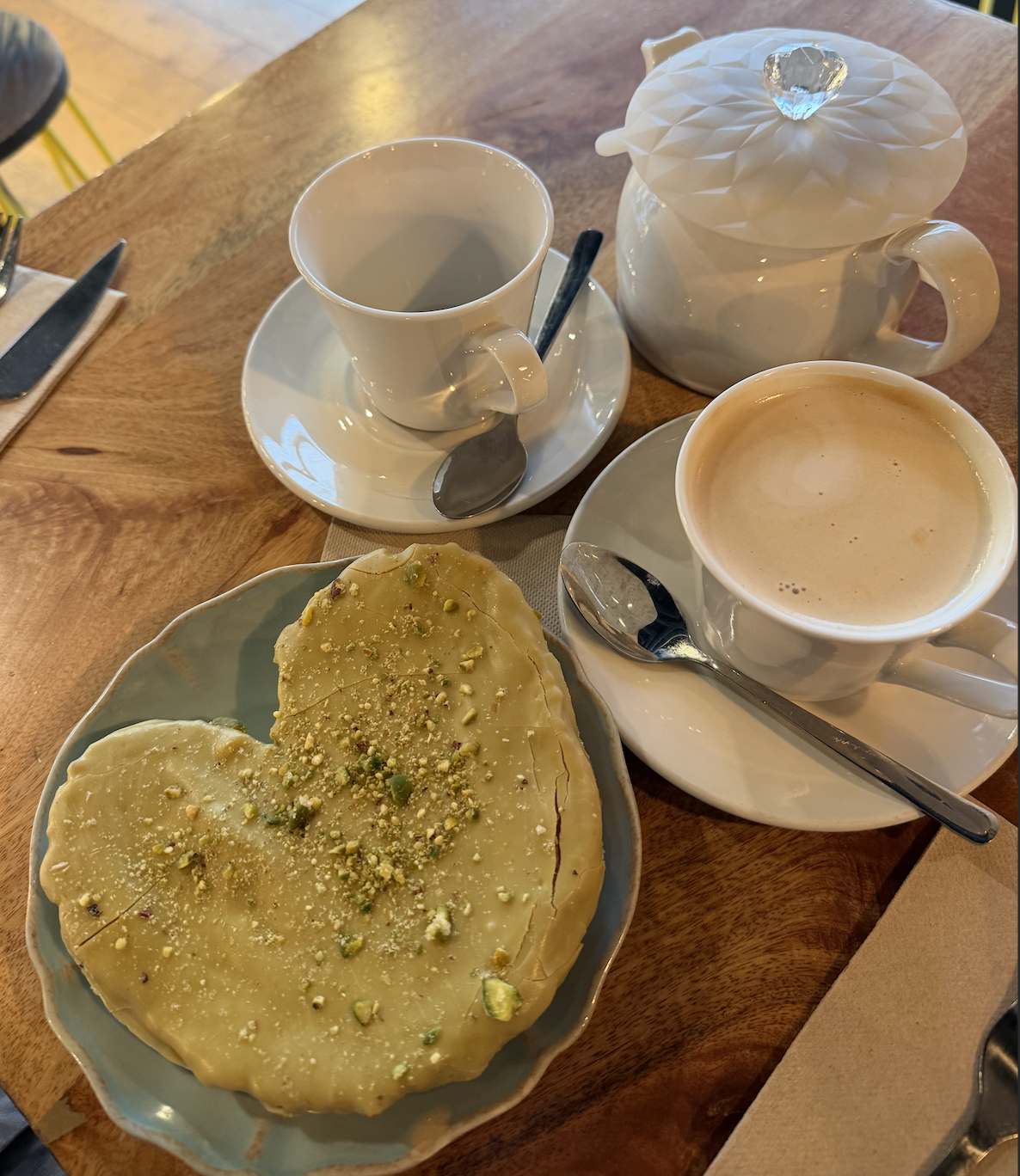 Enjoying gluten free baked goods and coffee at Celicioso