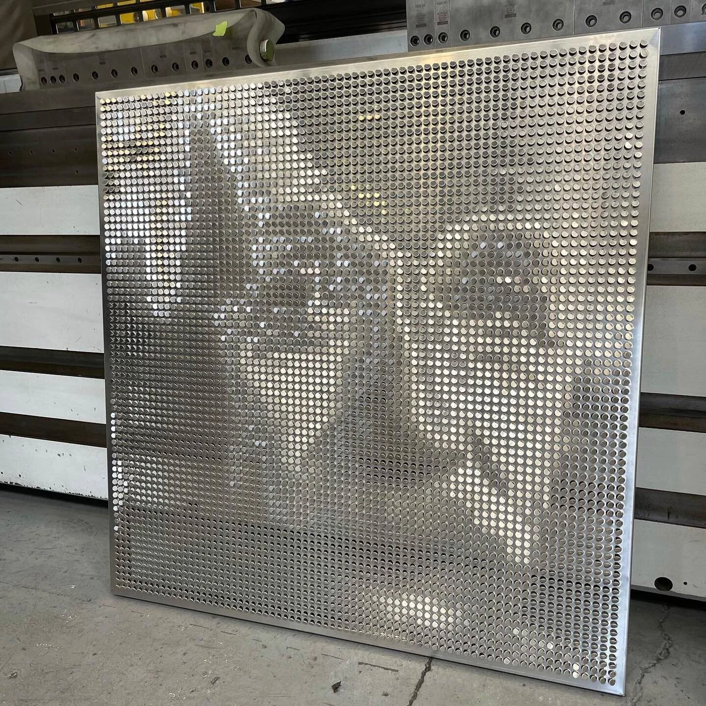 Great example of our Ombrae Optical Tiles! Can you guess who the genius in the photo is?.. &ldquo;Imagination is more important than knowledge.&rdquo; 

#sheetmetalfabrication #ombrae #enginering  #architecturaldesign #nzmade #architecture #design