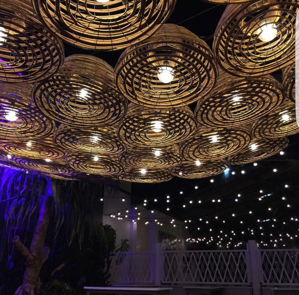 Ceiling lighting using cane 55cm lobster pots, pricing from $85.