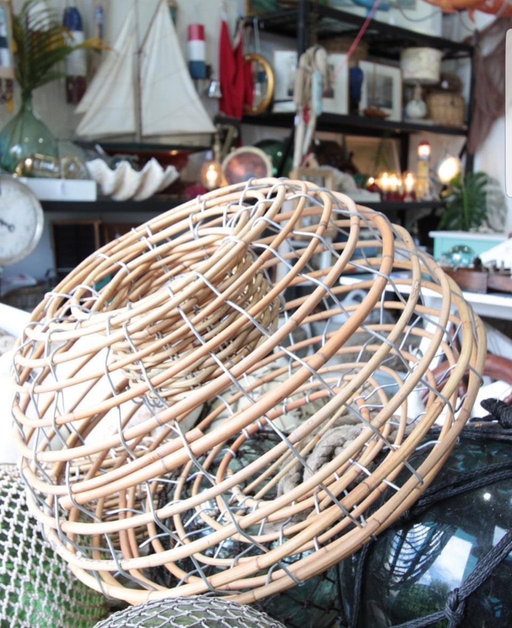 Standard cane lobster trap used as shop dressing.