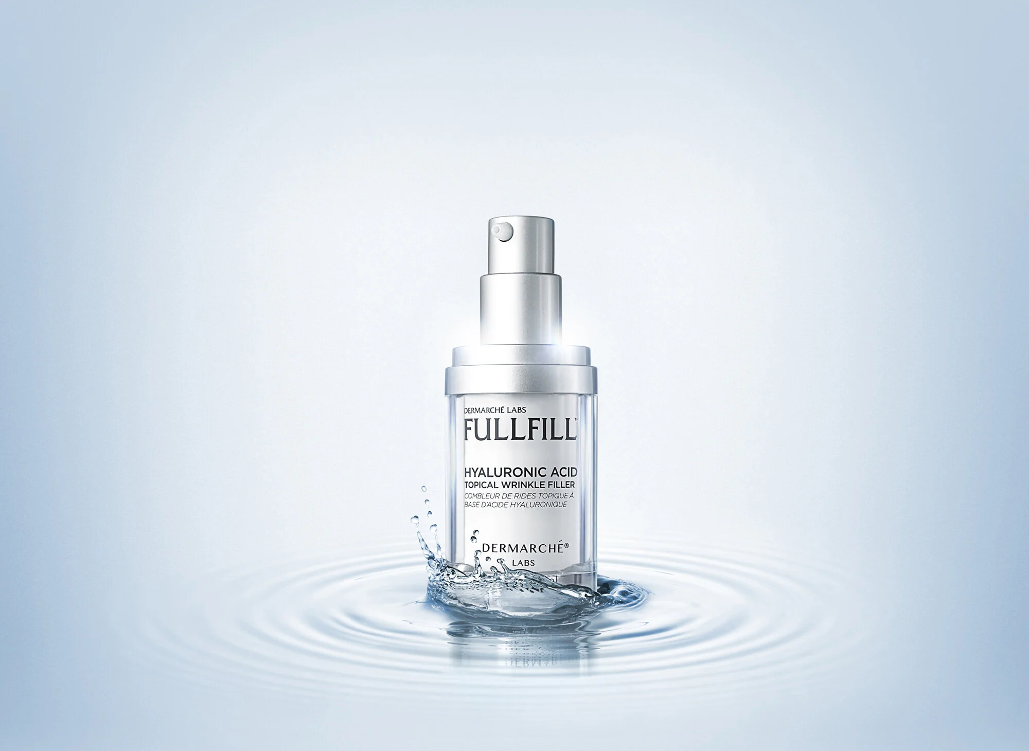 Dermarché Labs Fullfill Hyaluronic Acid serum bottle on water surface with splash, white background.