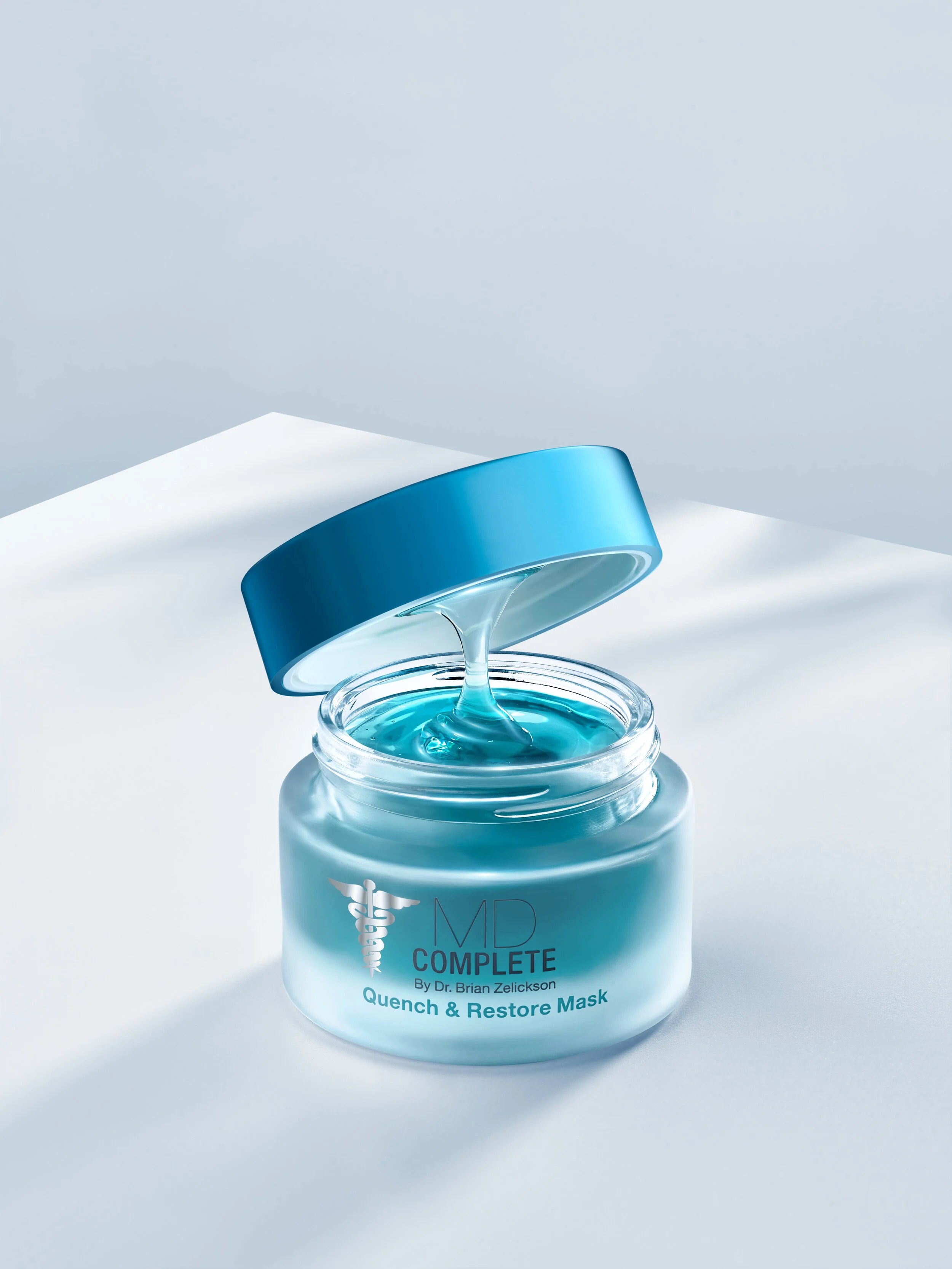 MD Complete Quench & Restore Mask jar with blue lid, open, showing blue gel contents.