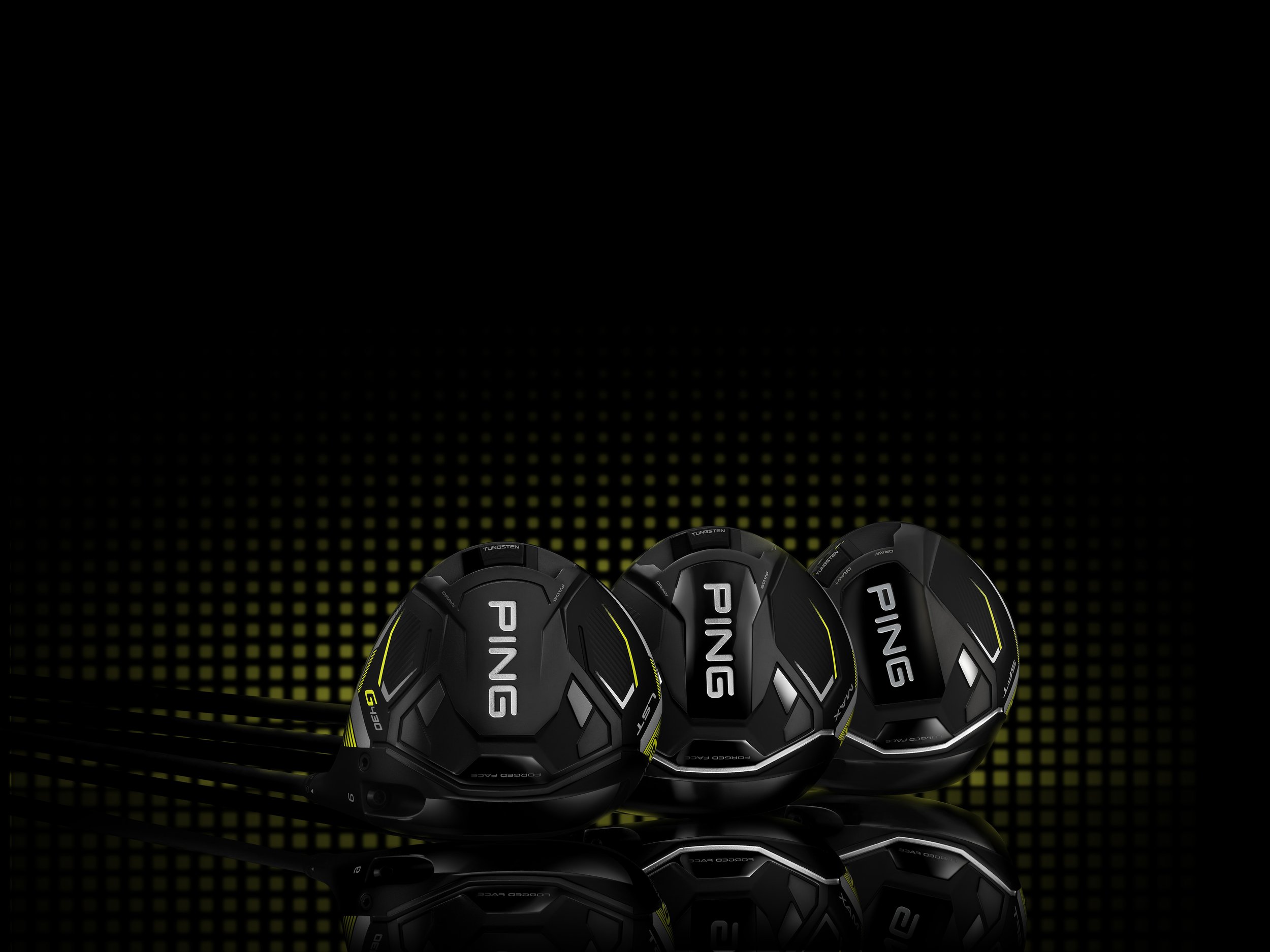 Three Ping golf club heads on black and green gradient background.