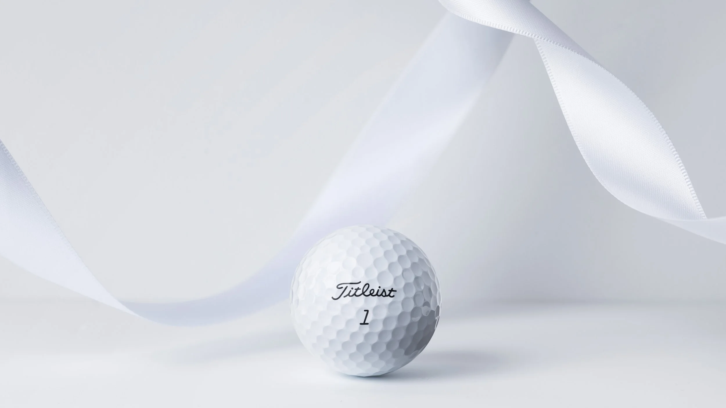 Titleist golf ball with white ribbon
