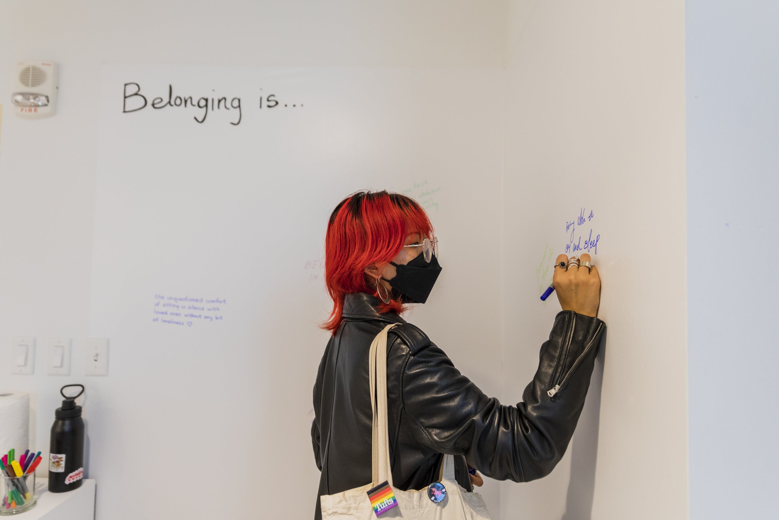 "GHOST ROOTS: A New 강강술래 Ganggangsullae" Opening Reception Attendee Contributing To Gallery Interactive Wall