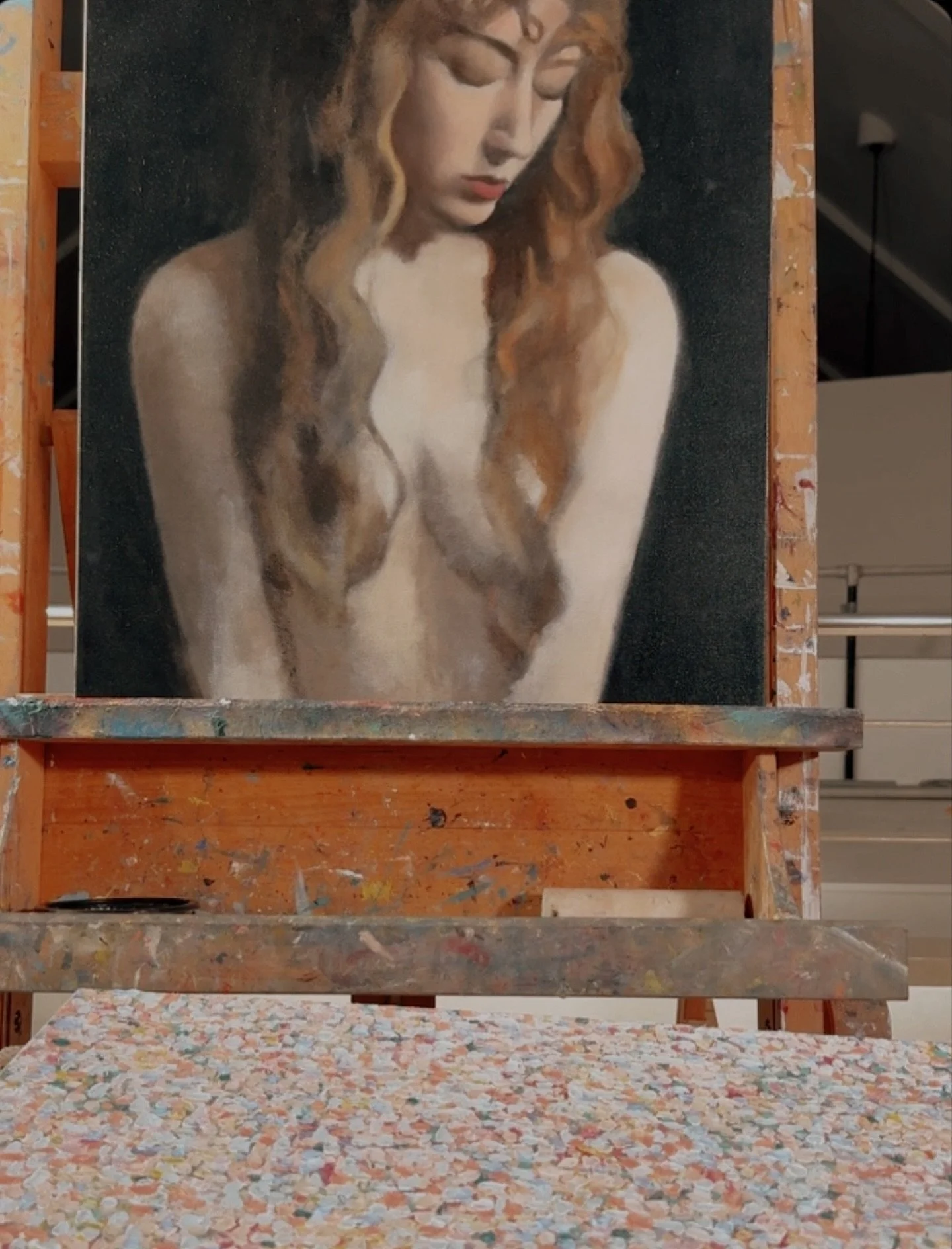 New atmospheric abstract, Pale Sky, in the foreground.
 An unfinished portrait rests in the background, waiting its turn. Both are personal works. One finished, one still in progress.

Some paintings arrive and resolve quickly.
Others ask for space, 