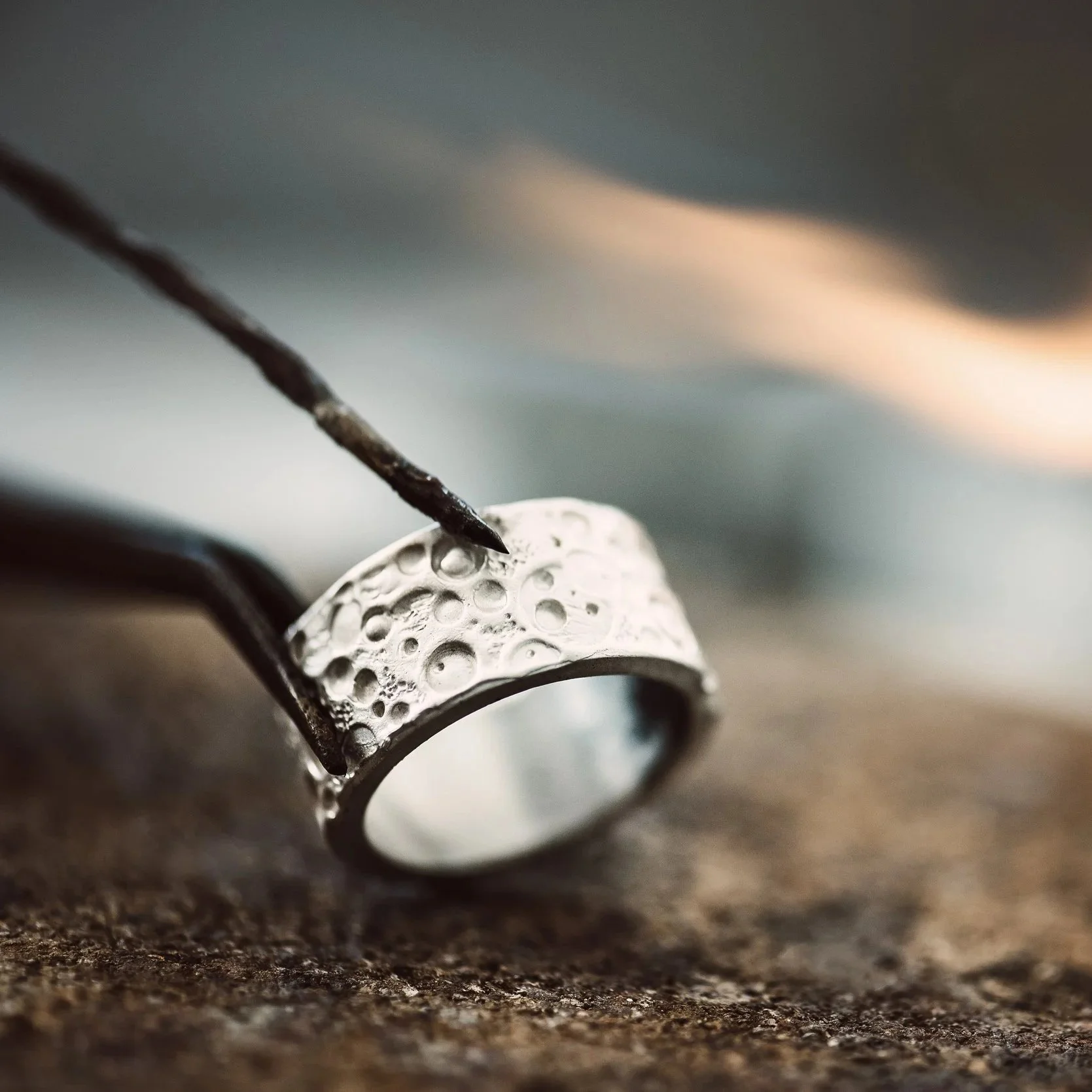 fire-and-ice-close-up-view-of-beautiful-silver-ri-2026-03-24-21-37-44-utc.jpg