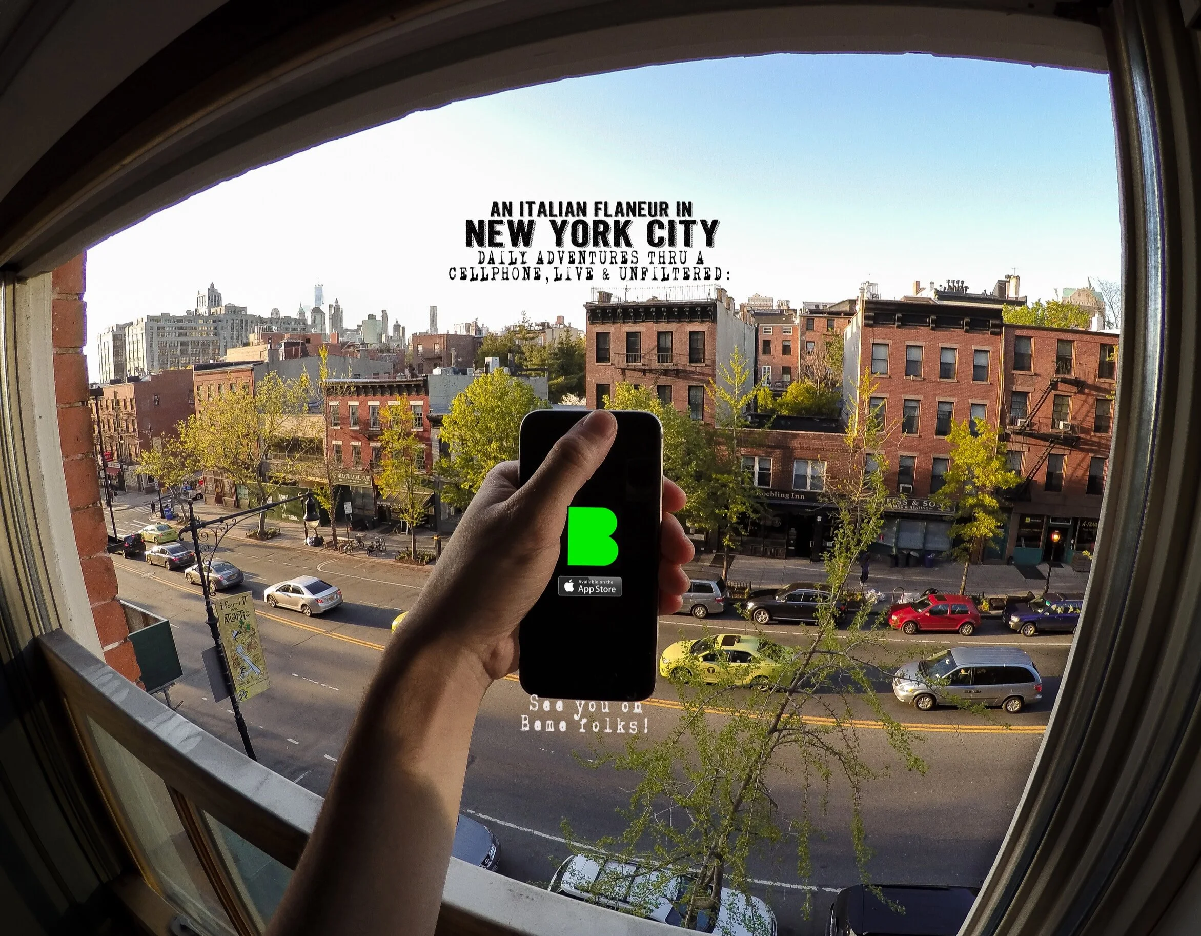 A person holding a smartphone in front of a window, capturing a photo of a cityscape with brick buildings and cars parked along the street, with text on the window reading "An Italian Flaneur in New York City" and "See you on Bone Folks!" about the c