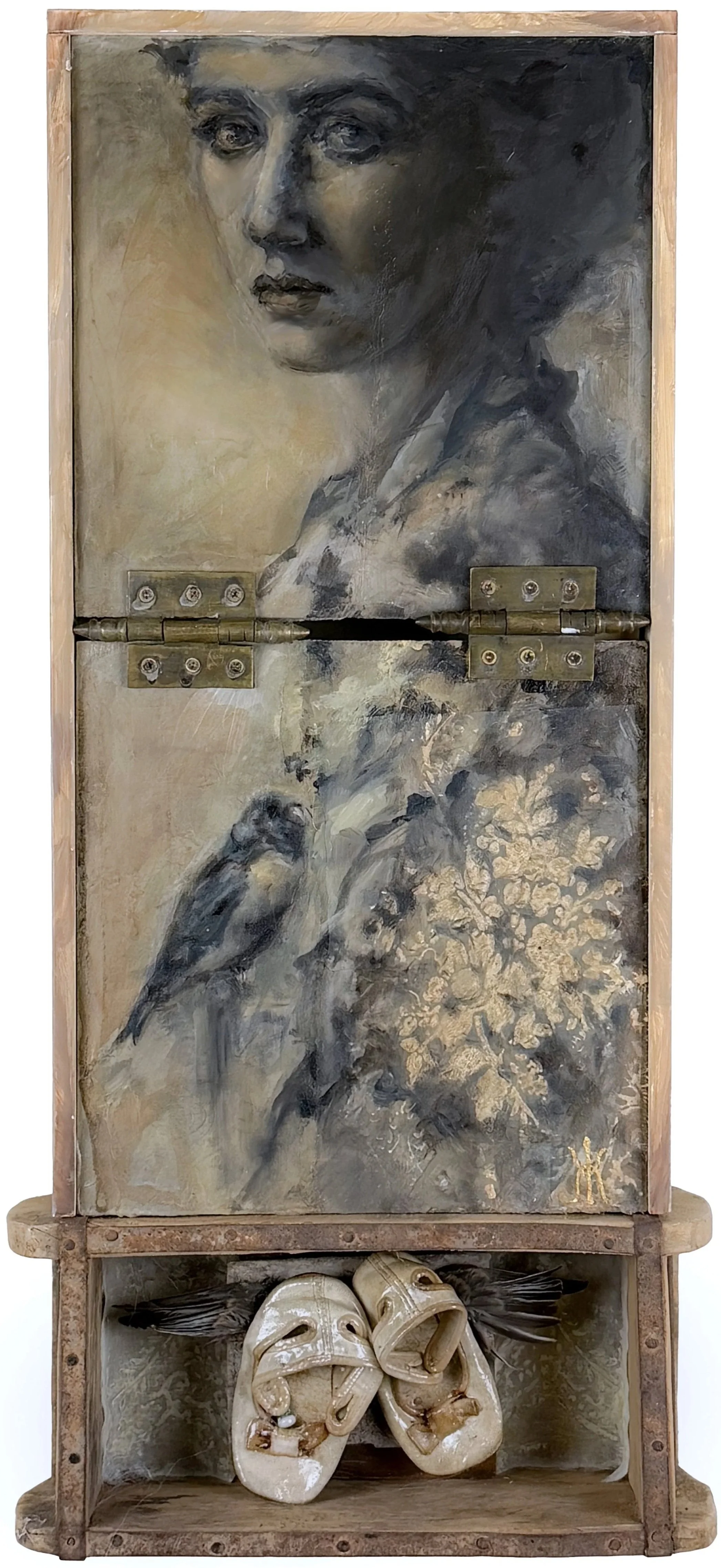  
  An Ache Where You Should Be    
 
 an ache where you should be  
 small shoes remember the weight  
 of a vanished step  
 




  








 
2025 
27H x 11W x 4D in. 




  




 
Mixed media assemblage incorporating textiles, hinges, found objec