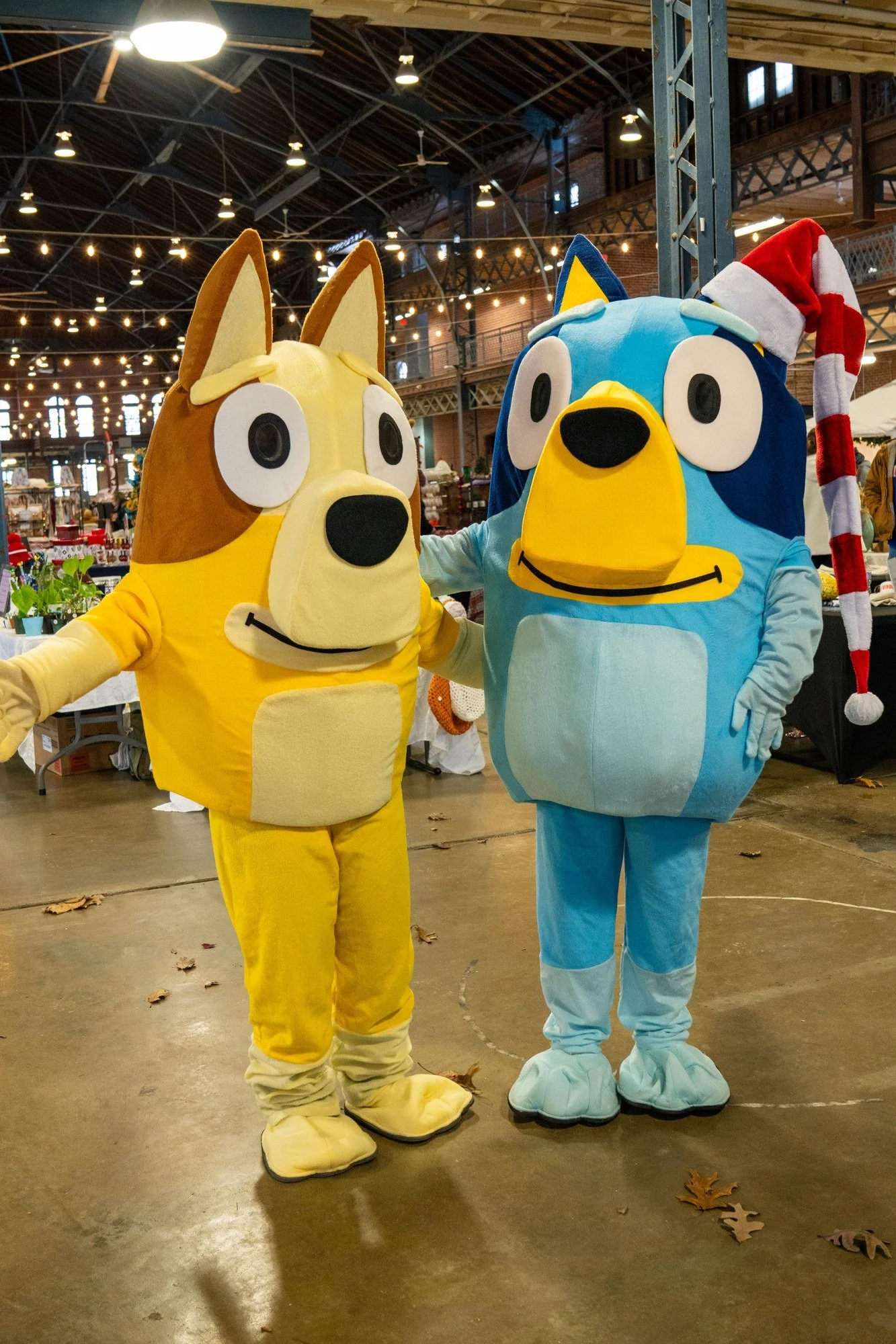 Bluey and Bingo greet families at the Illinois Local Holiday Market on Small Business Saturday in Springfield, IL