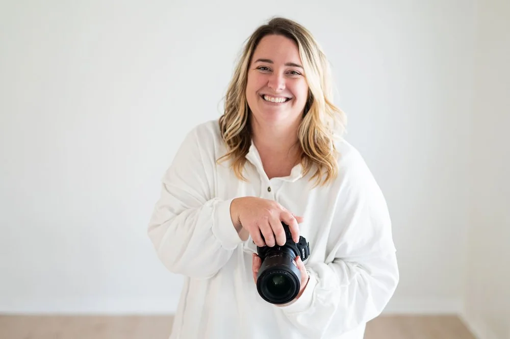 Illinois Local member photographer smiling and holding a camera