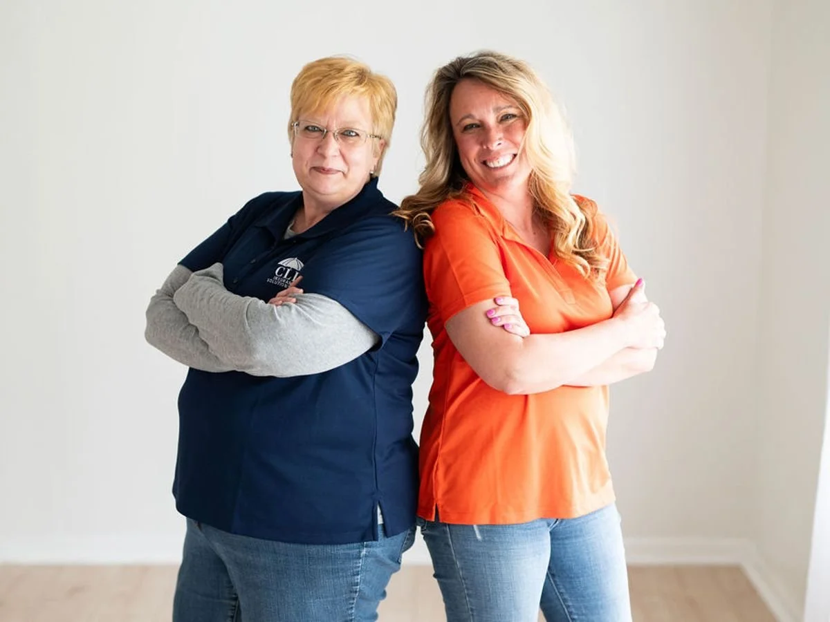 Two Illinois Local member business owners standing back to back with arms crossed