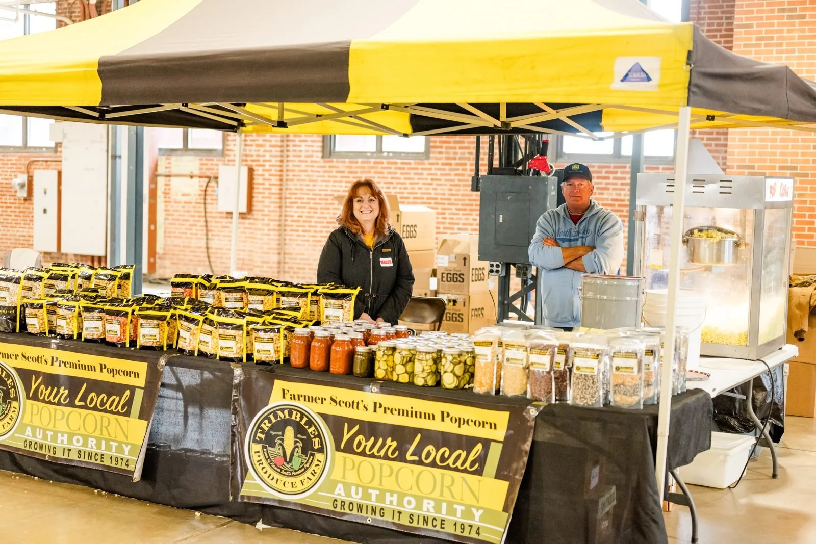 Illinois small business vendors selling local popcorn at the Illinois Local Holiday Market, a Small Business Saturday vendor event in Springfield, IL