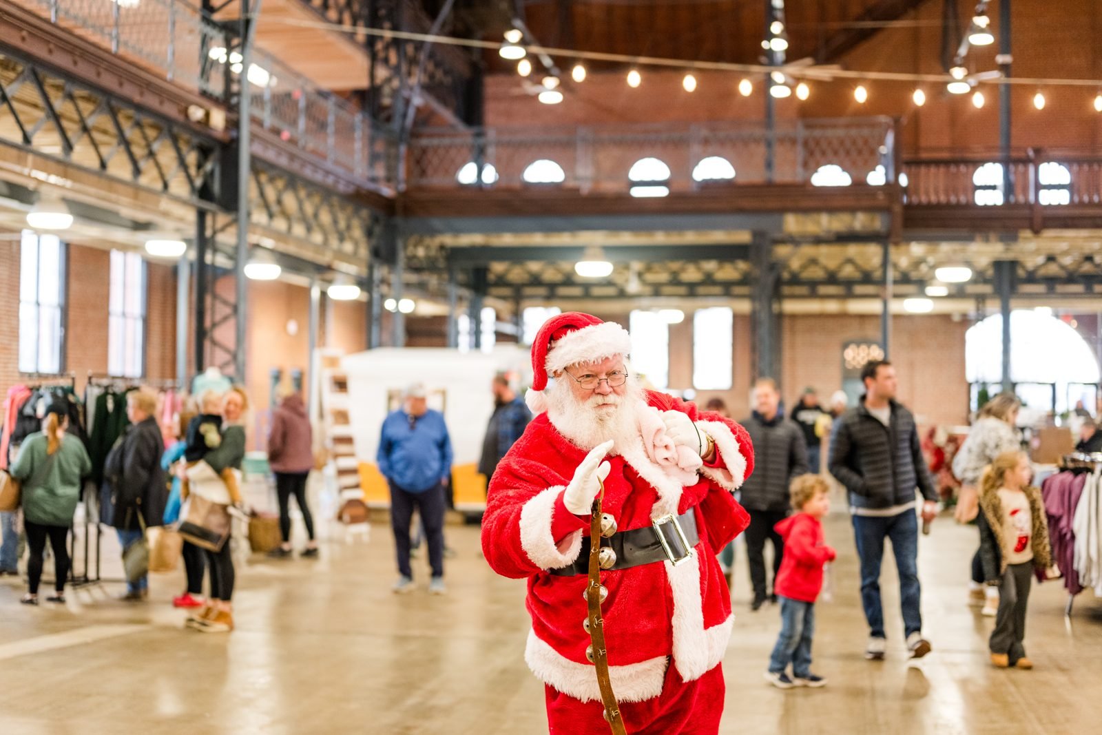 Santa waving to families at the Illinois Local Holiday Market on Small Business Saturday in Springfield, IL