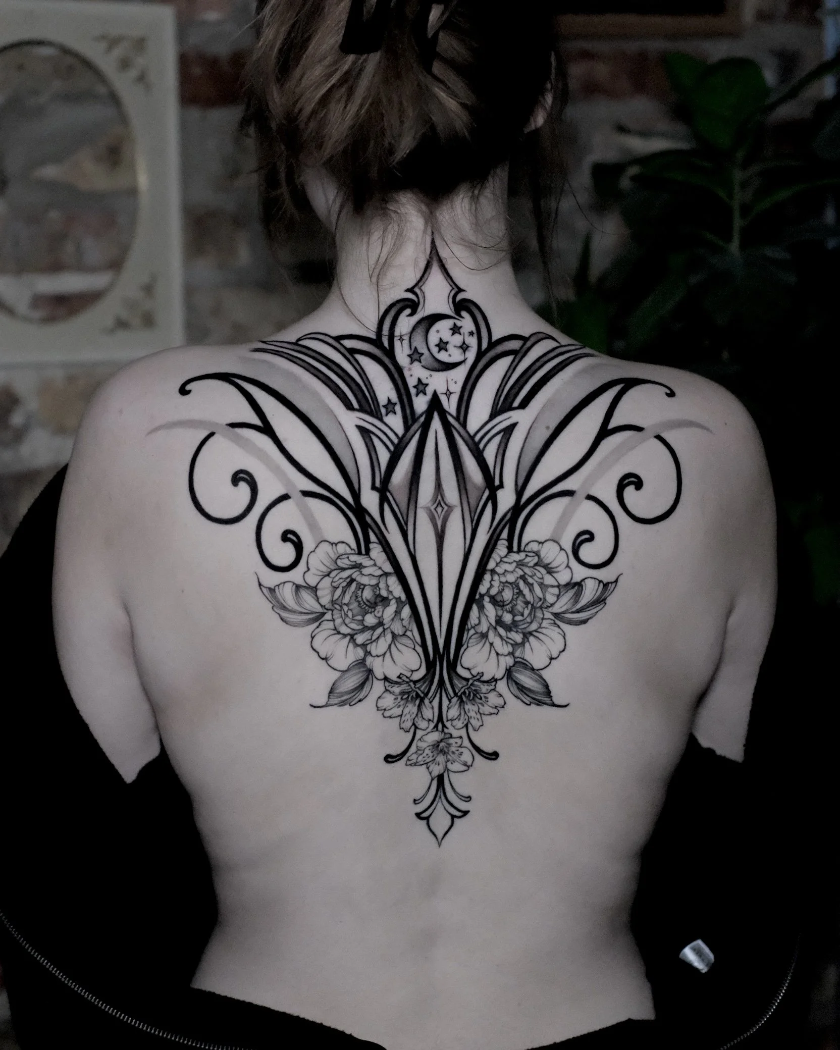 ornamental back tattoo design with symmetrical architecture and peony flowers. negative space with light shading 