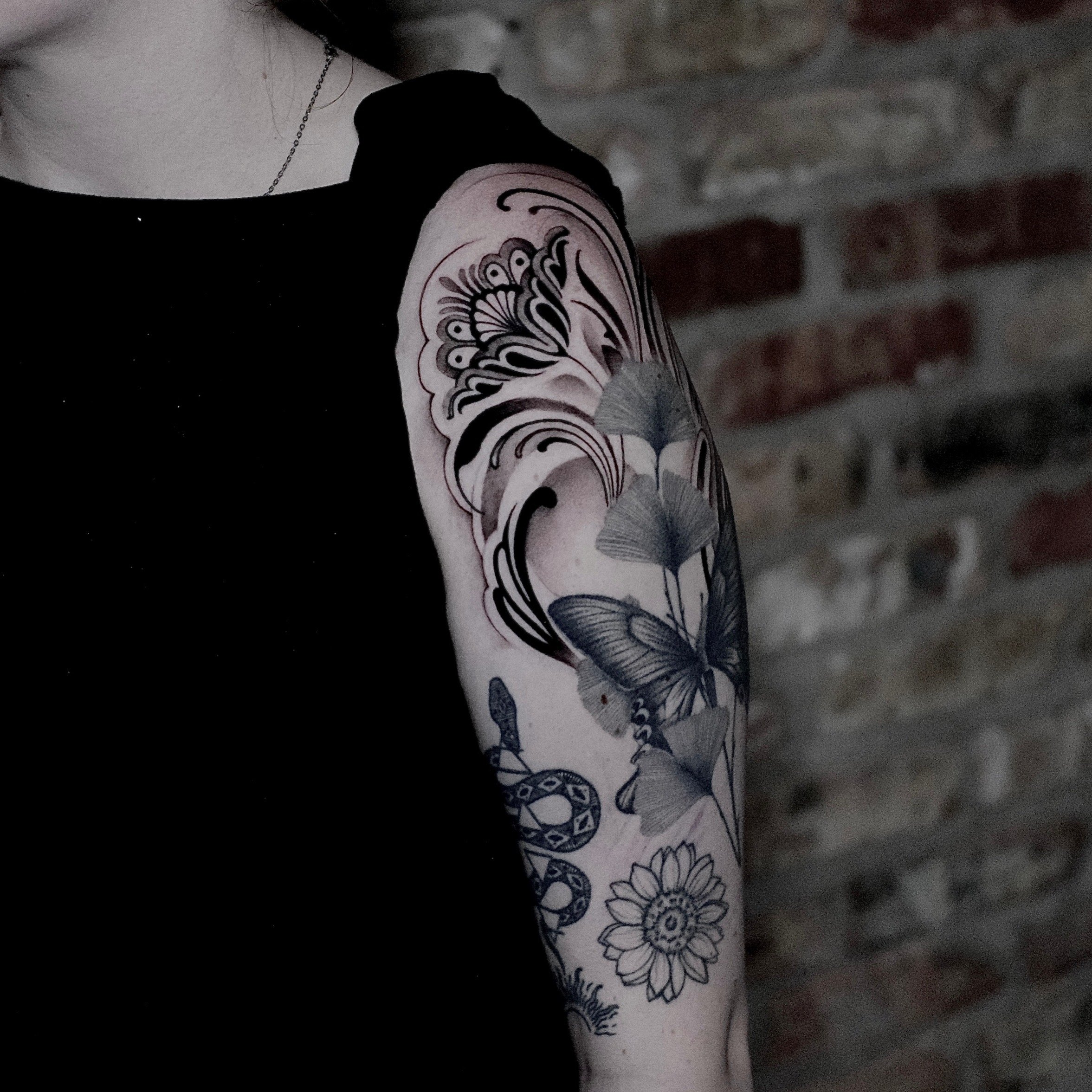 ornamental black and grey flower tattoo 