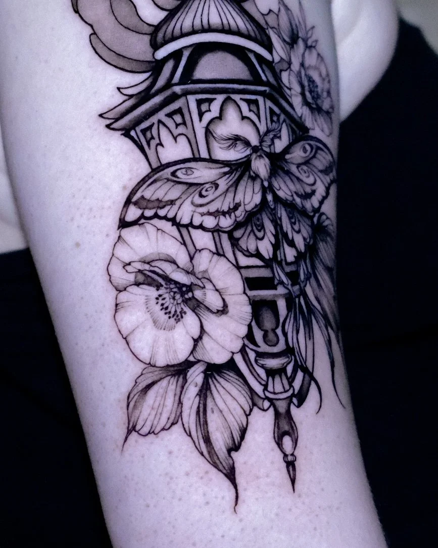 black work ornamental lantern tattoo with florals. peonies and poppies. 