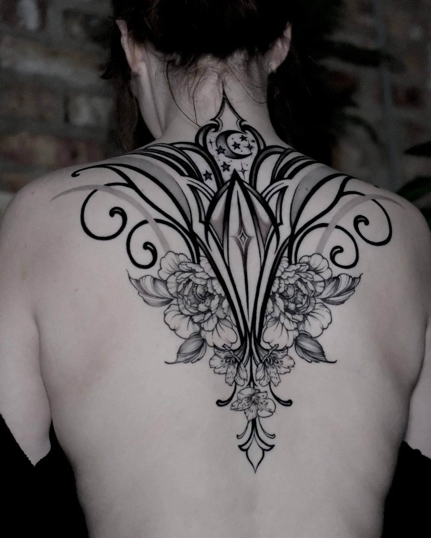 ornamental back tattoo design with symmetrical architecture and peony flowers. negative space with light shading 