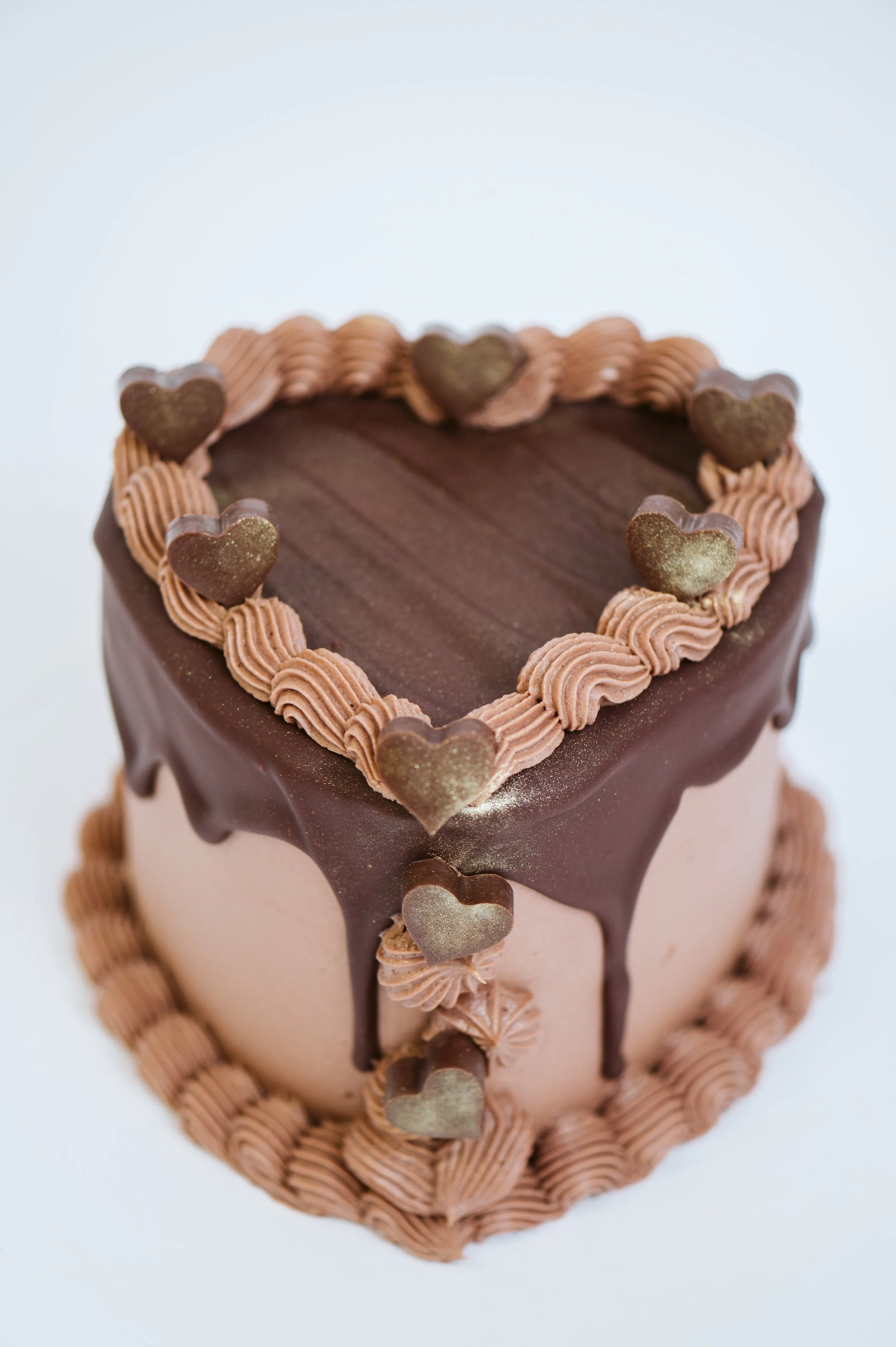 Chocolate espresso cake, chocolate buttercream, chocolate ganache drip, house made chocolate hearts 
