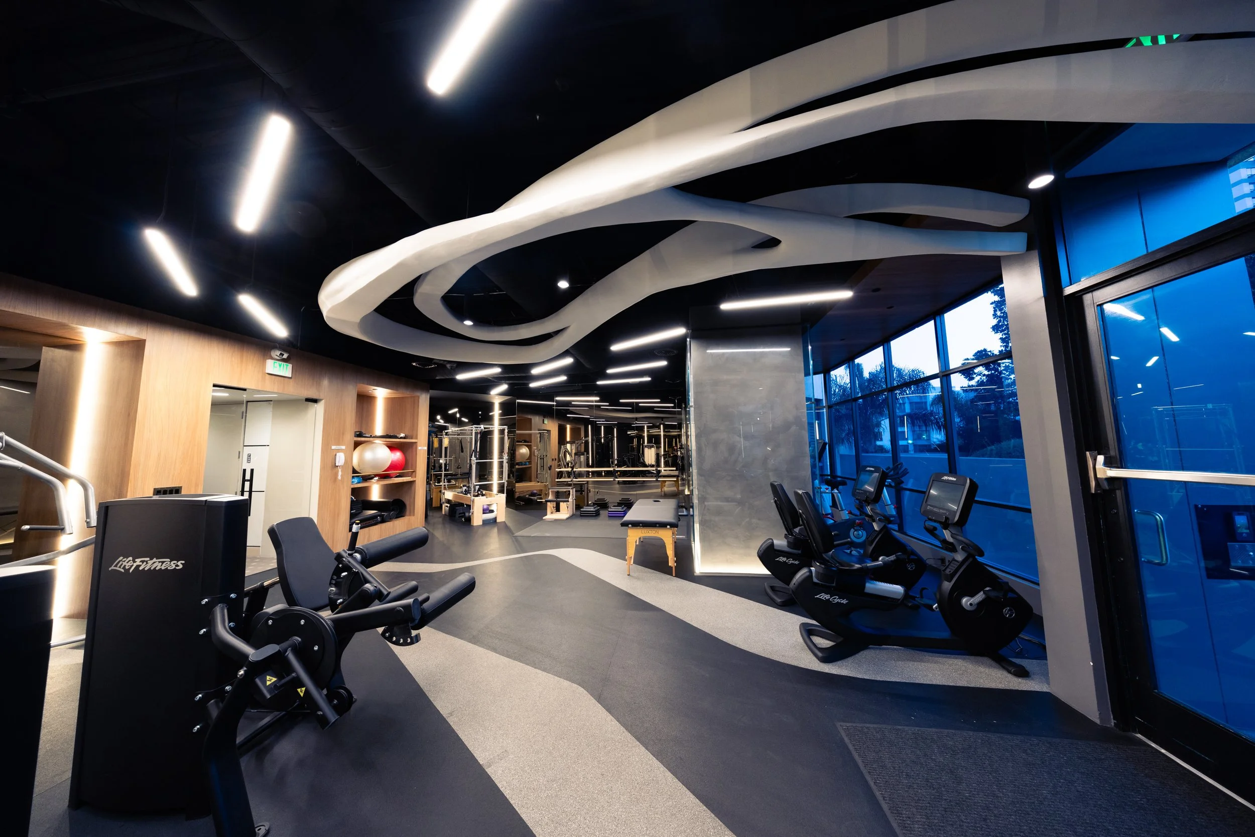 Completed Blair House gym designed as an elevated wellness and social space for residents.