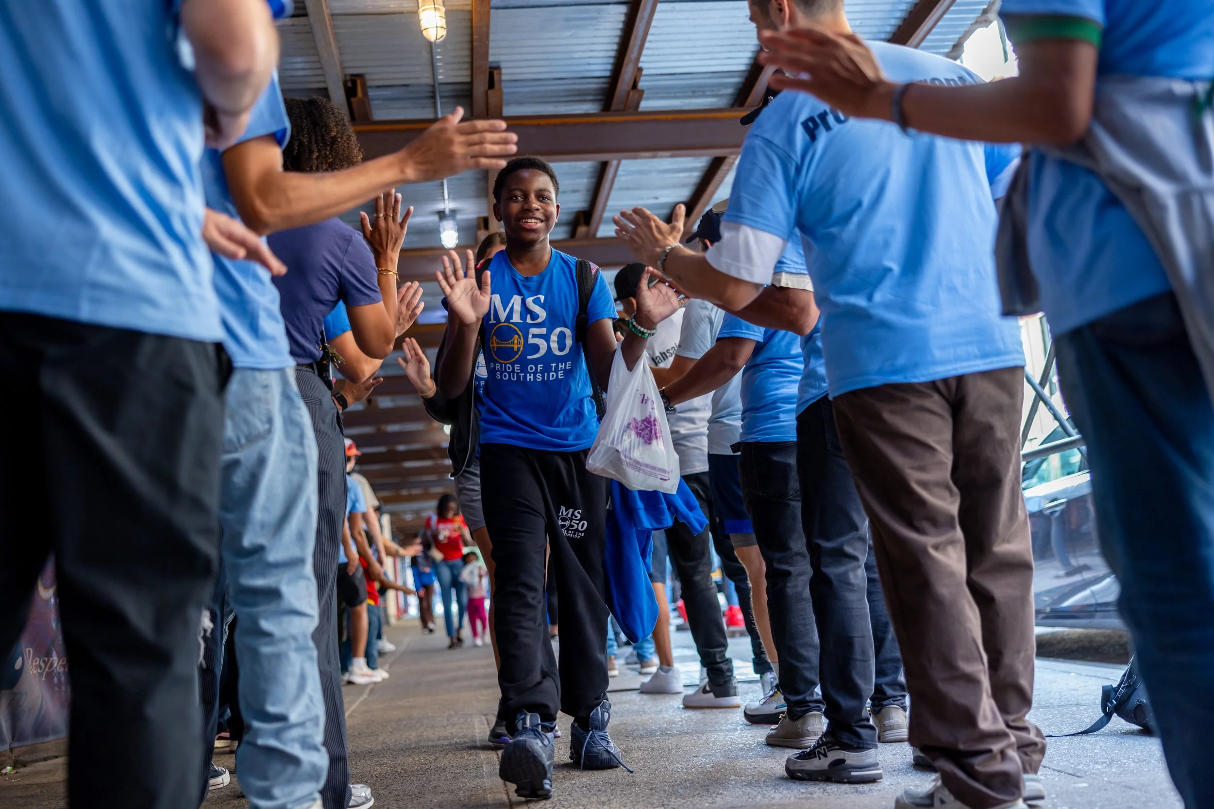 Students get high fives from parents