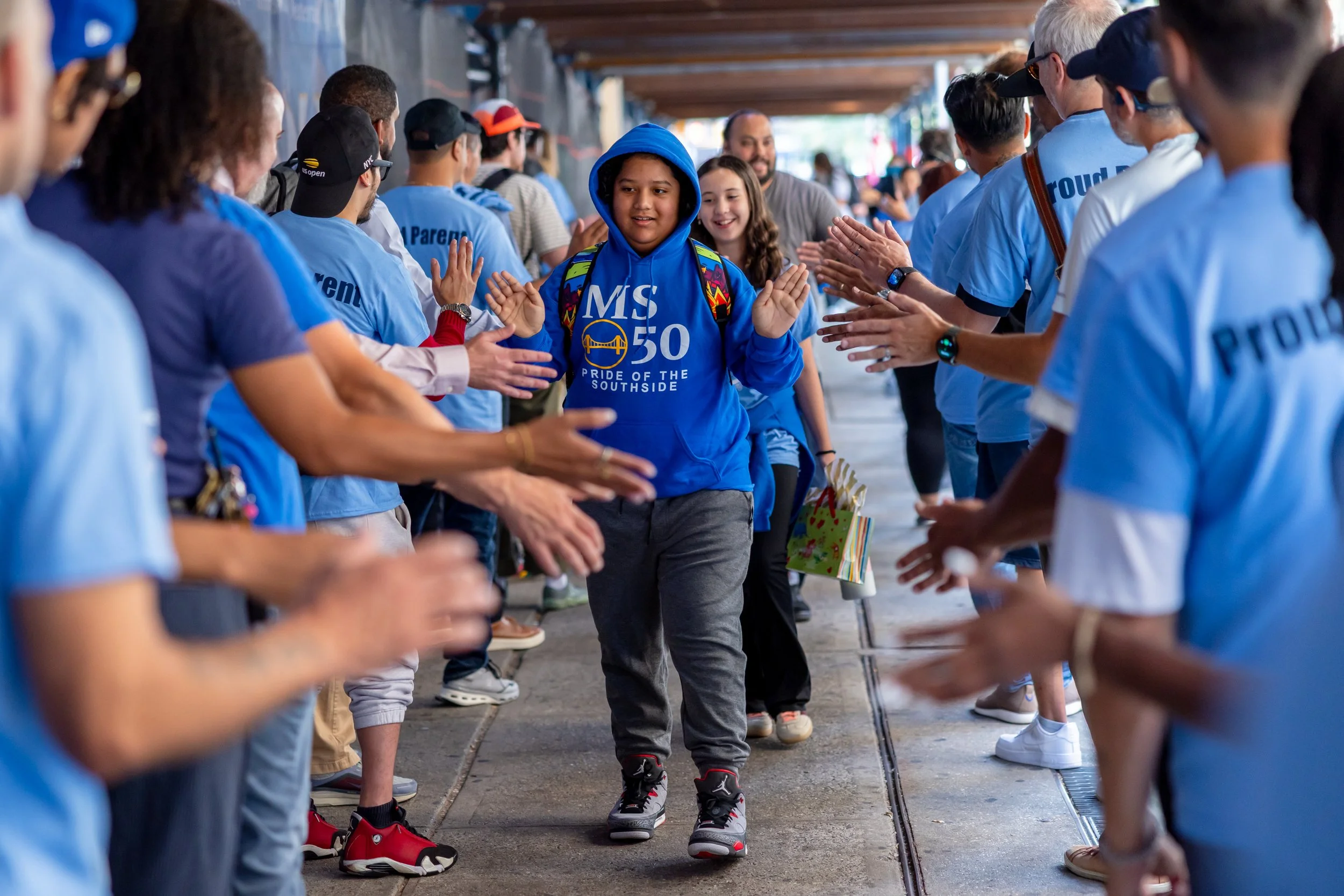 Students get high fives from parents