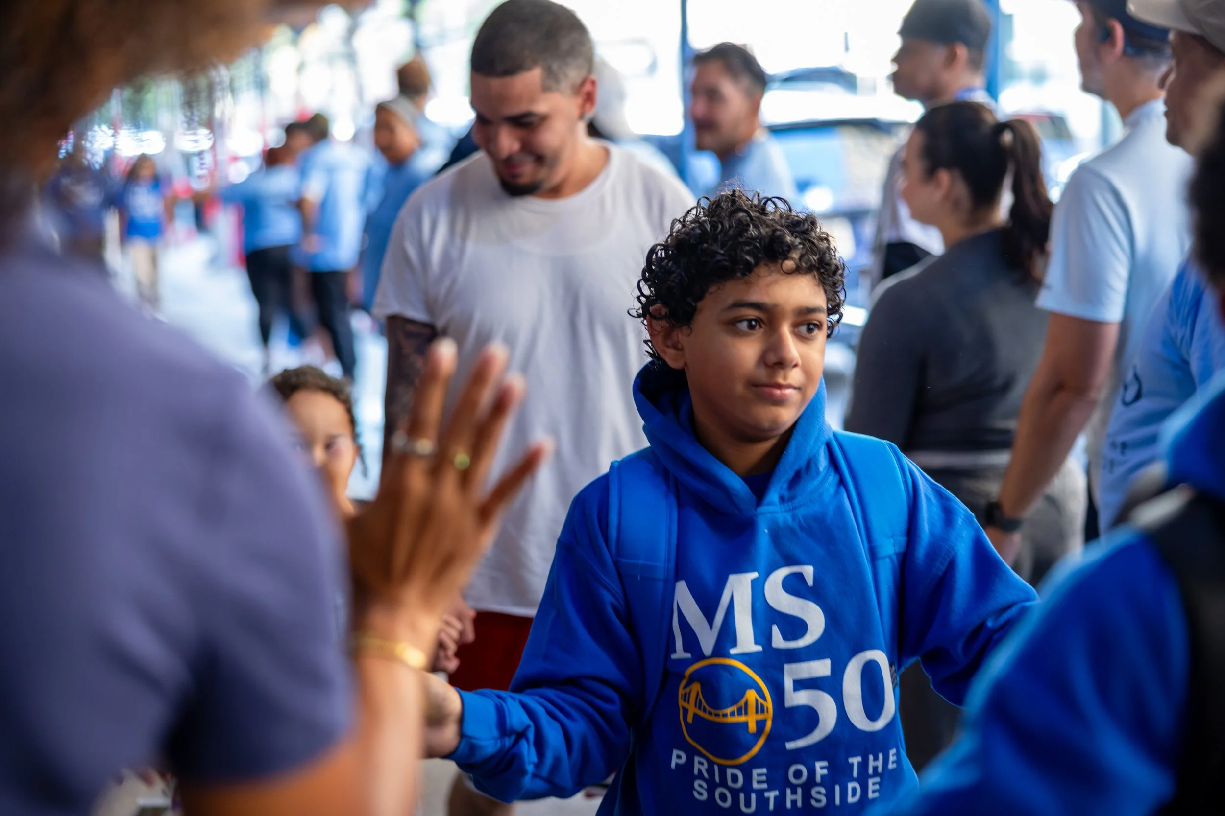 Students get high fives from parents