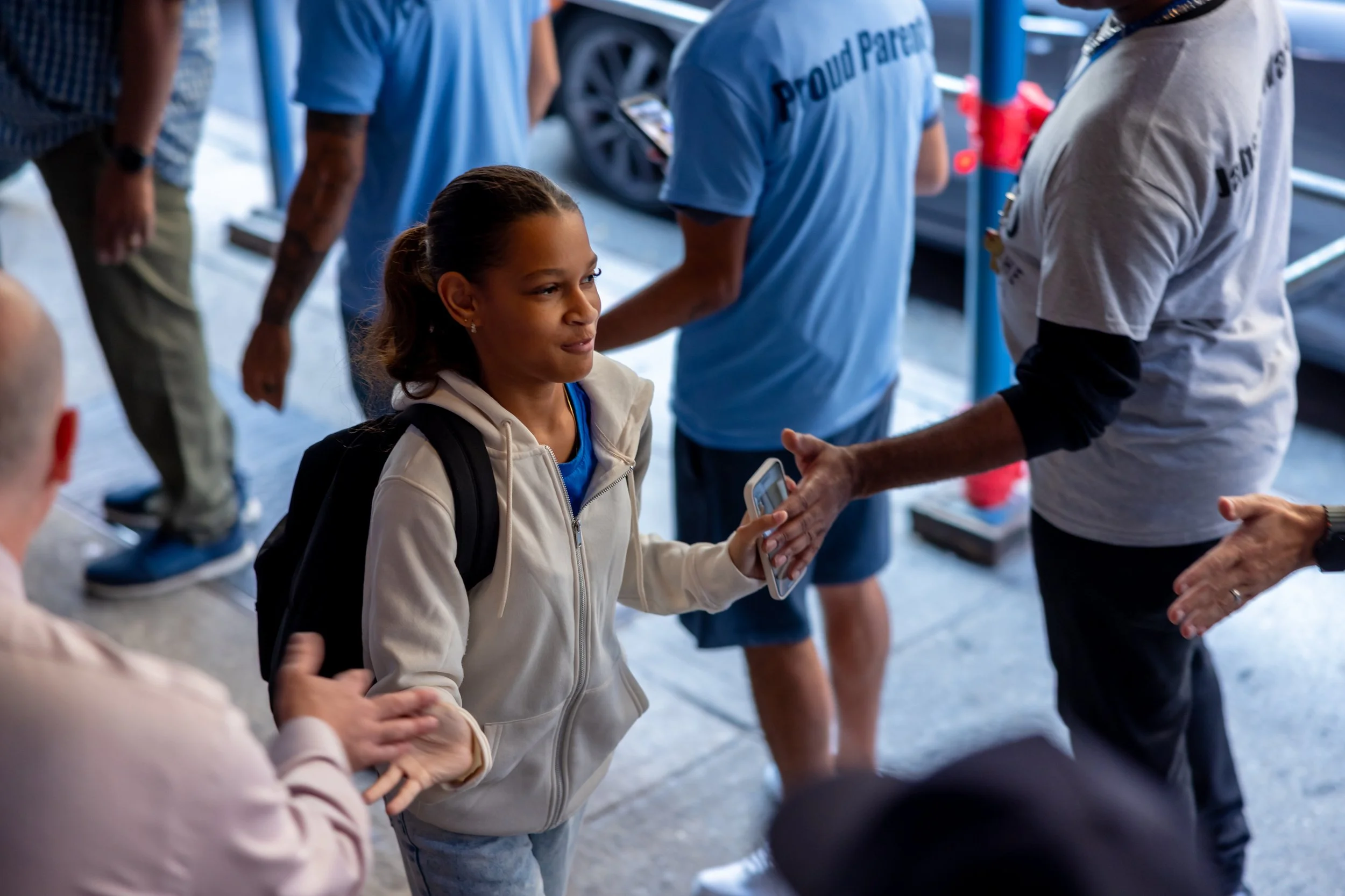 Students get high fives from parents