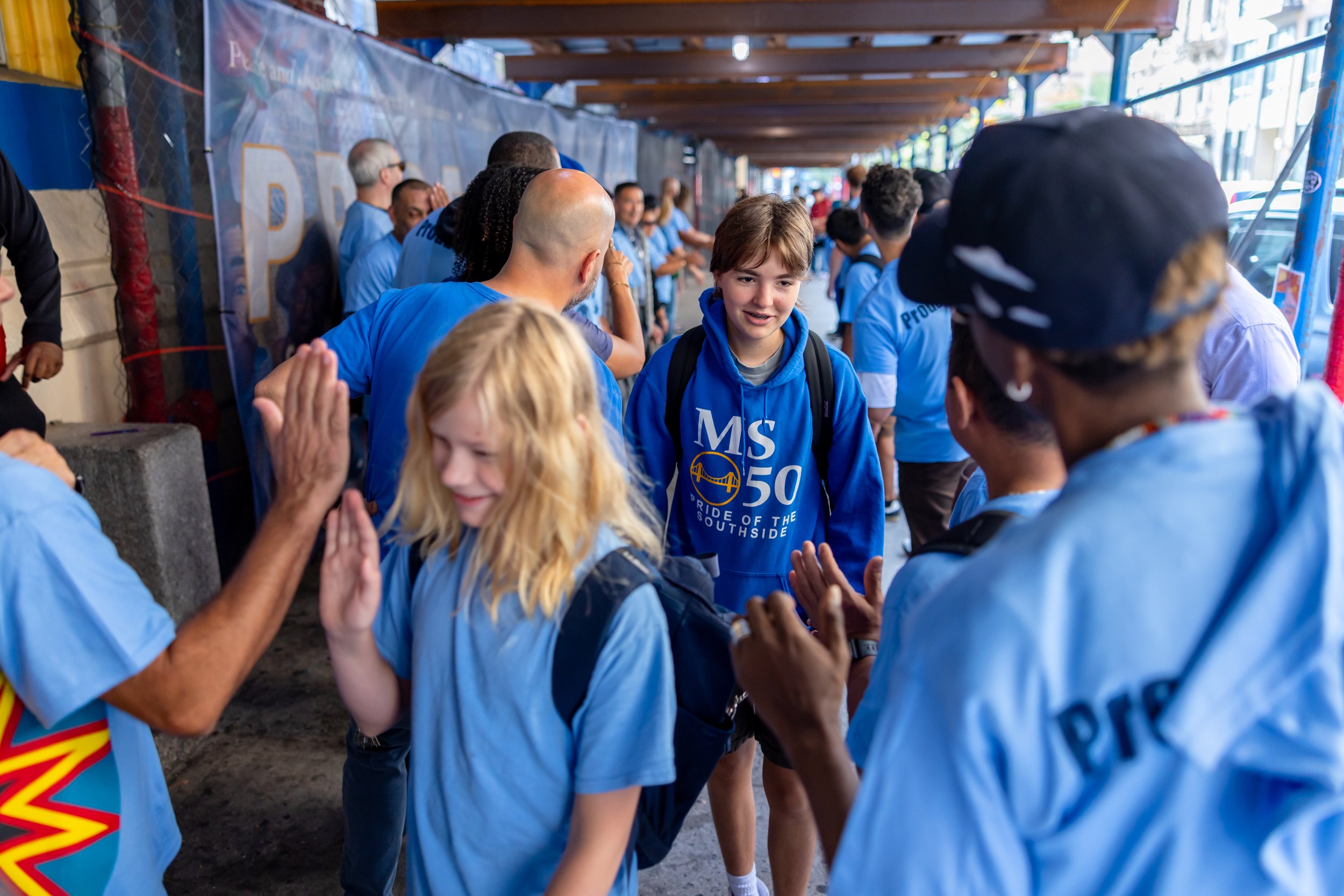 Students get high fives from parents